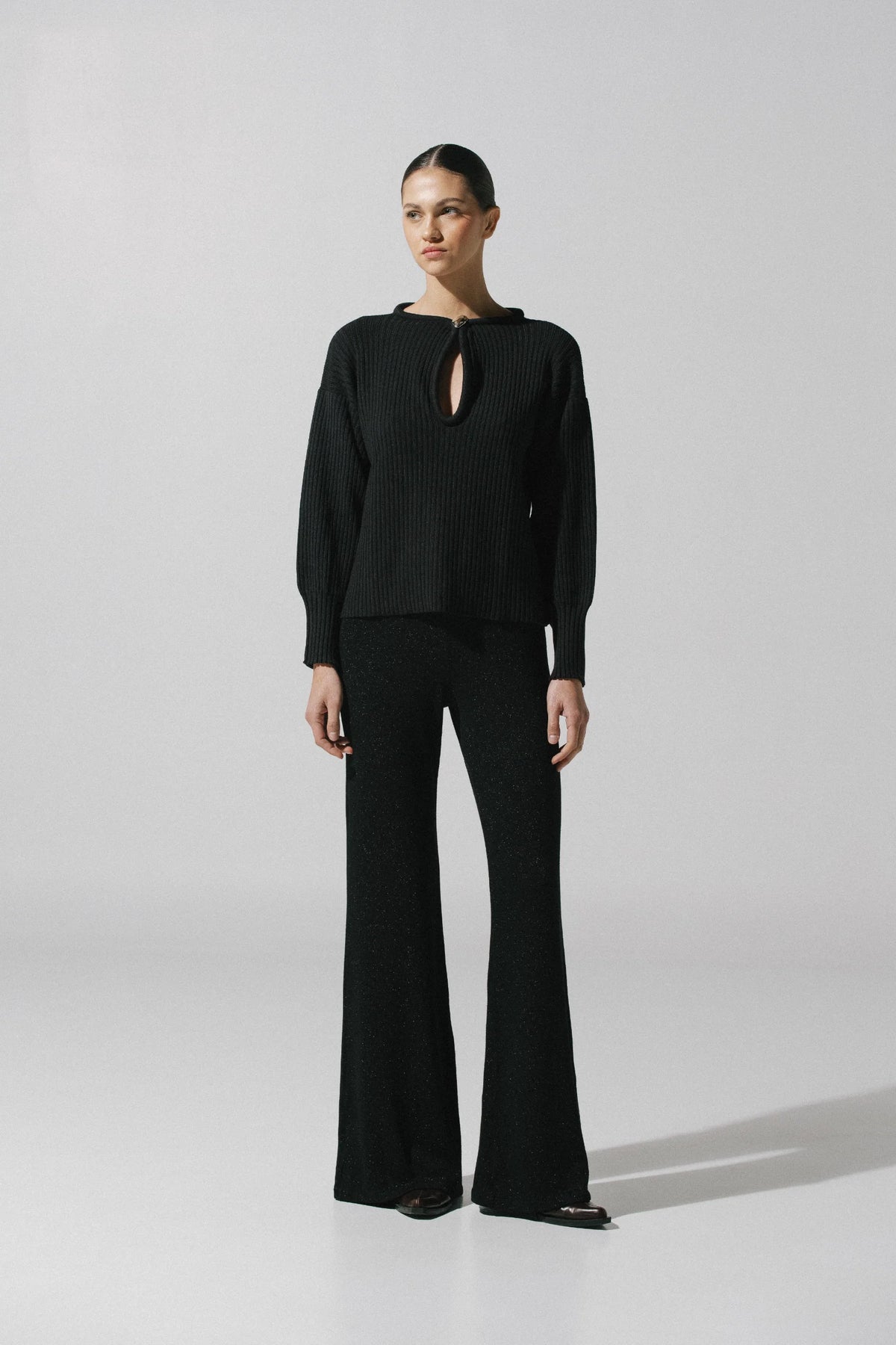 Black Akila Sweater, back view with relaxed silhouette and Unlined design.