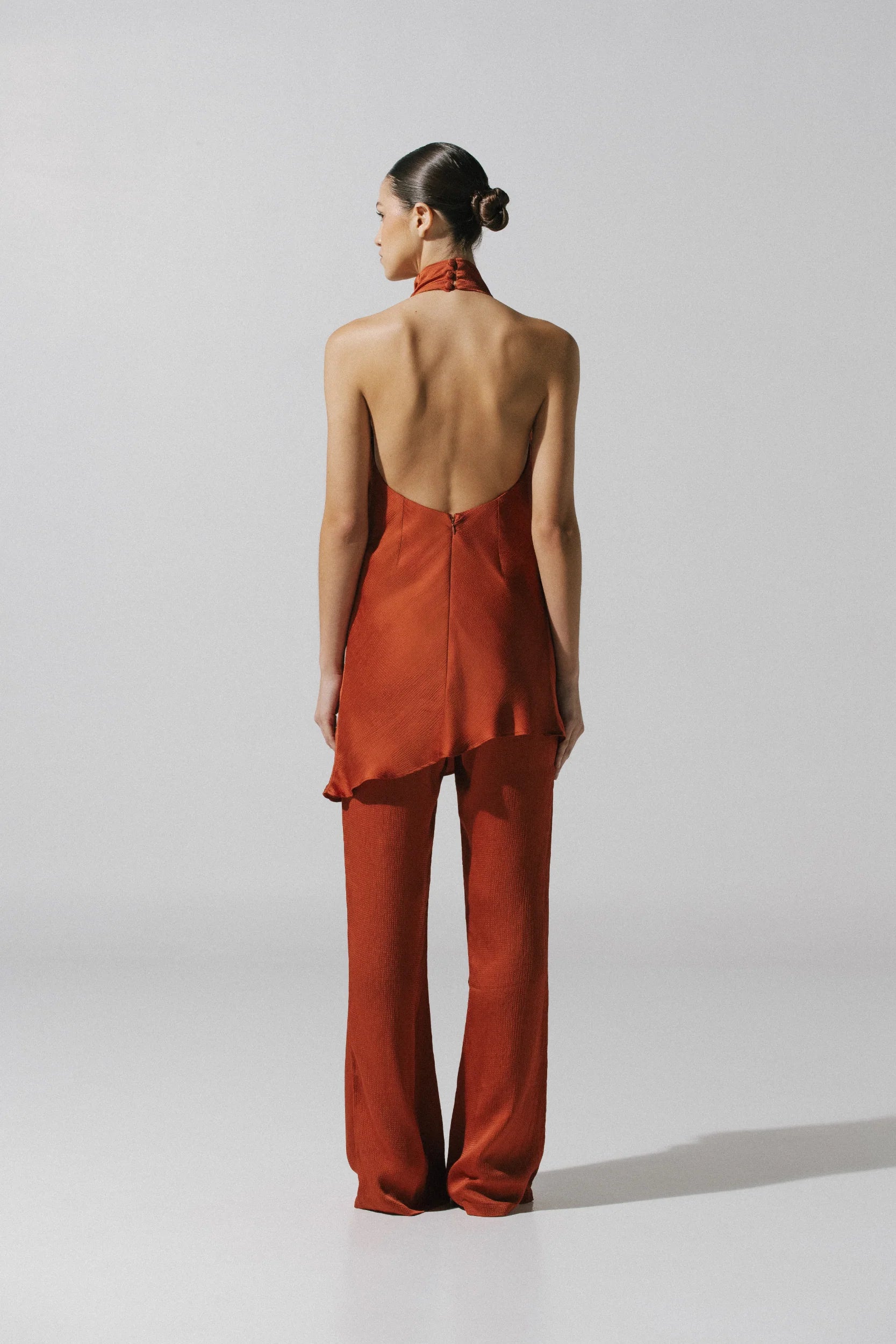Terracotta Numa Top with Open back, Halter Neckline and fluid fall.
