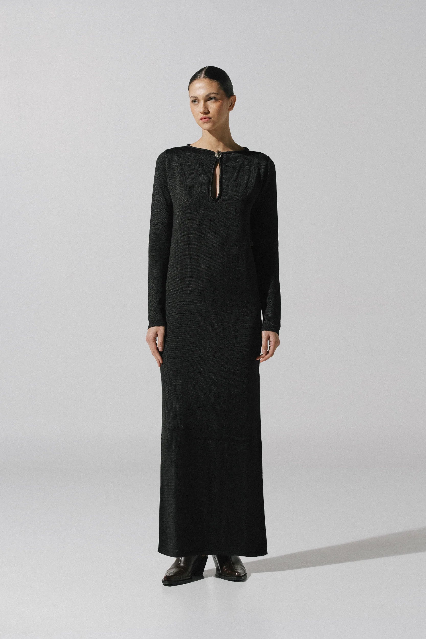 Ramila Maxi Dress by Baobab in black color, Round neckline with Front cutouts and Embellished hardware.
