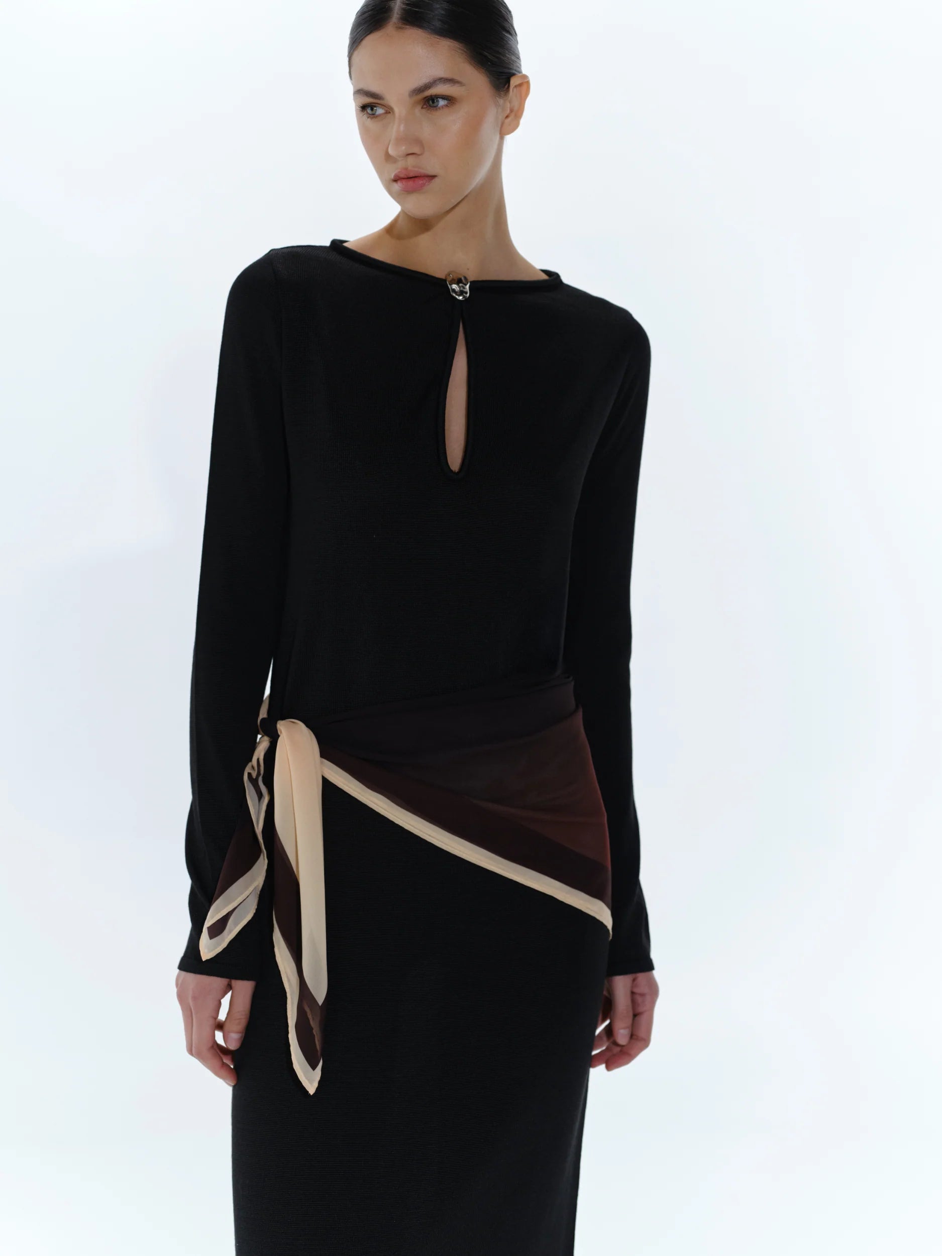 Black Ramila Dress, detail of Round neckline and Baobab hardware at front.
