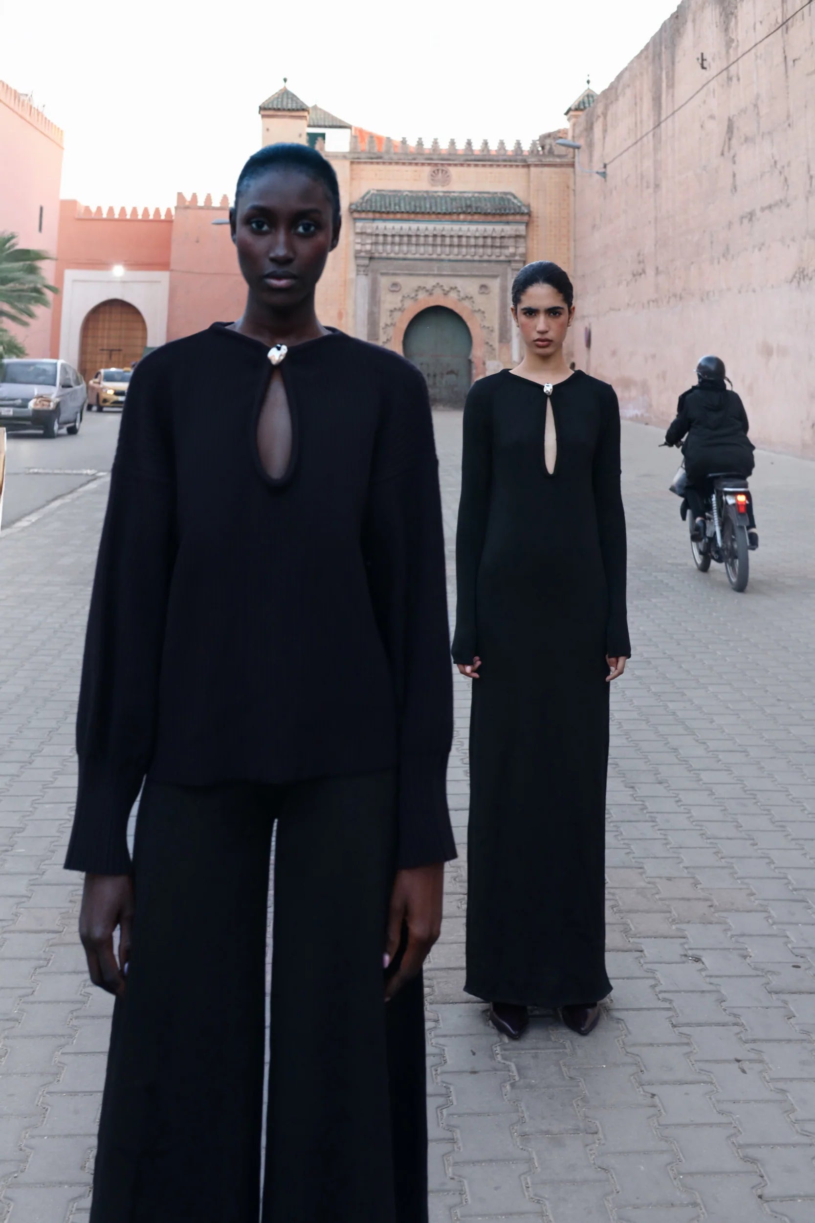 Black Ramila Dress, motion view with fluid fall and Long sleeves.