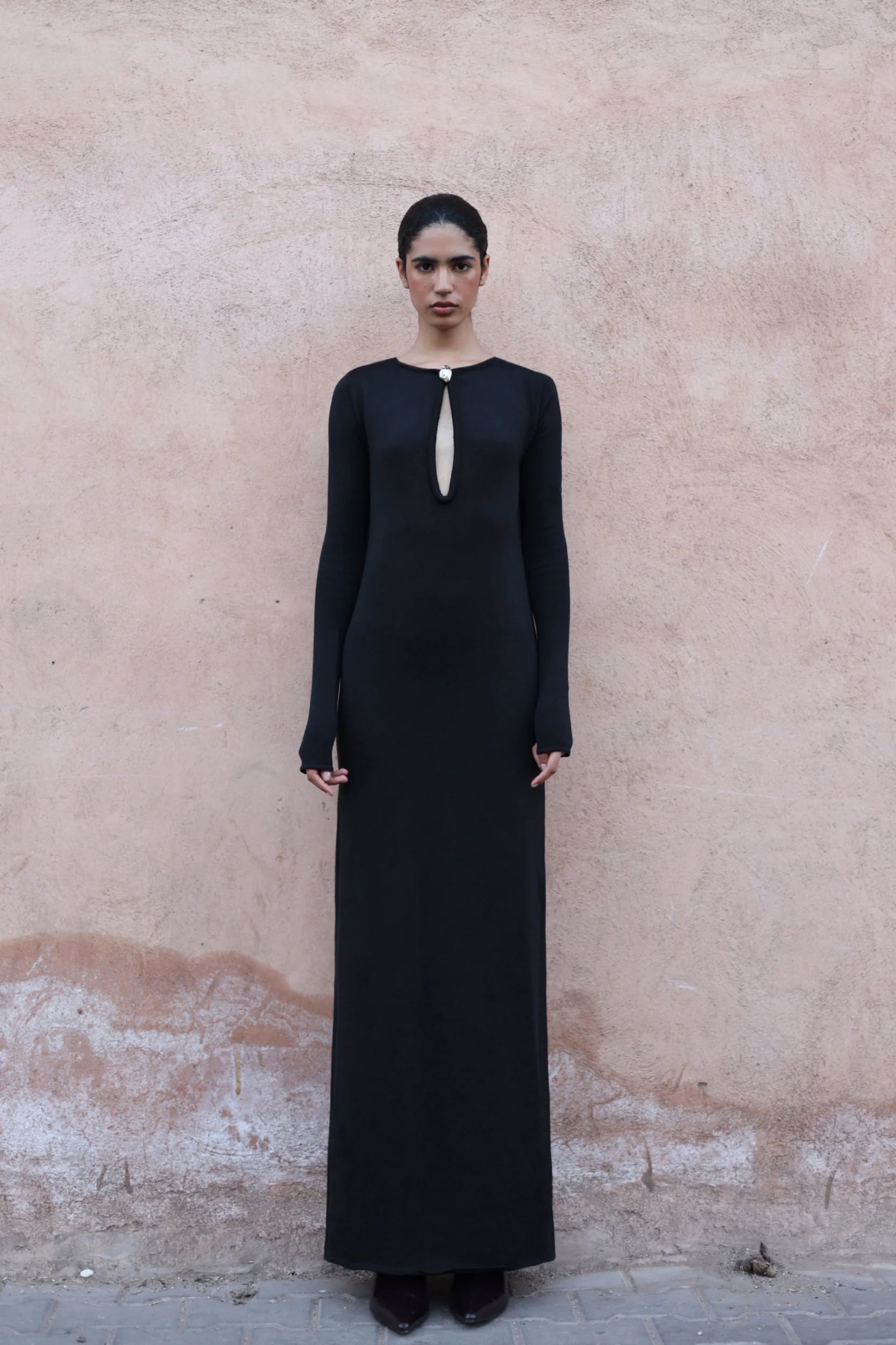 Detail of the Ramila Dress by Baobab, Front cutouts and Knit fabric in black color.