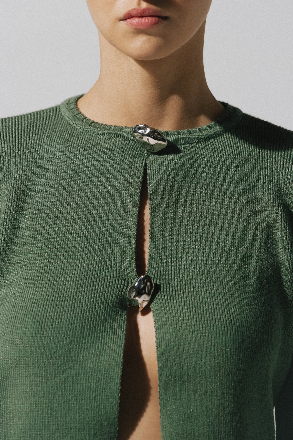 Sage green Meraky Sweater, back view with relaxed silhouette and Unlined design.