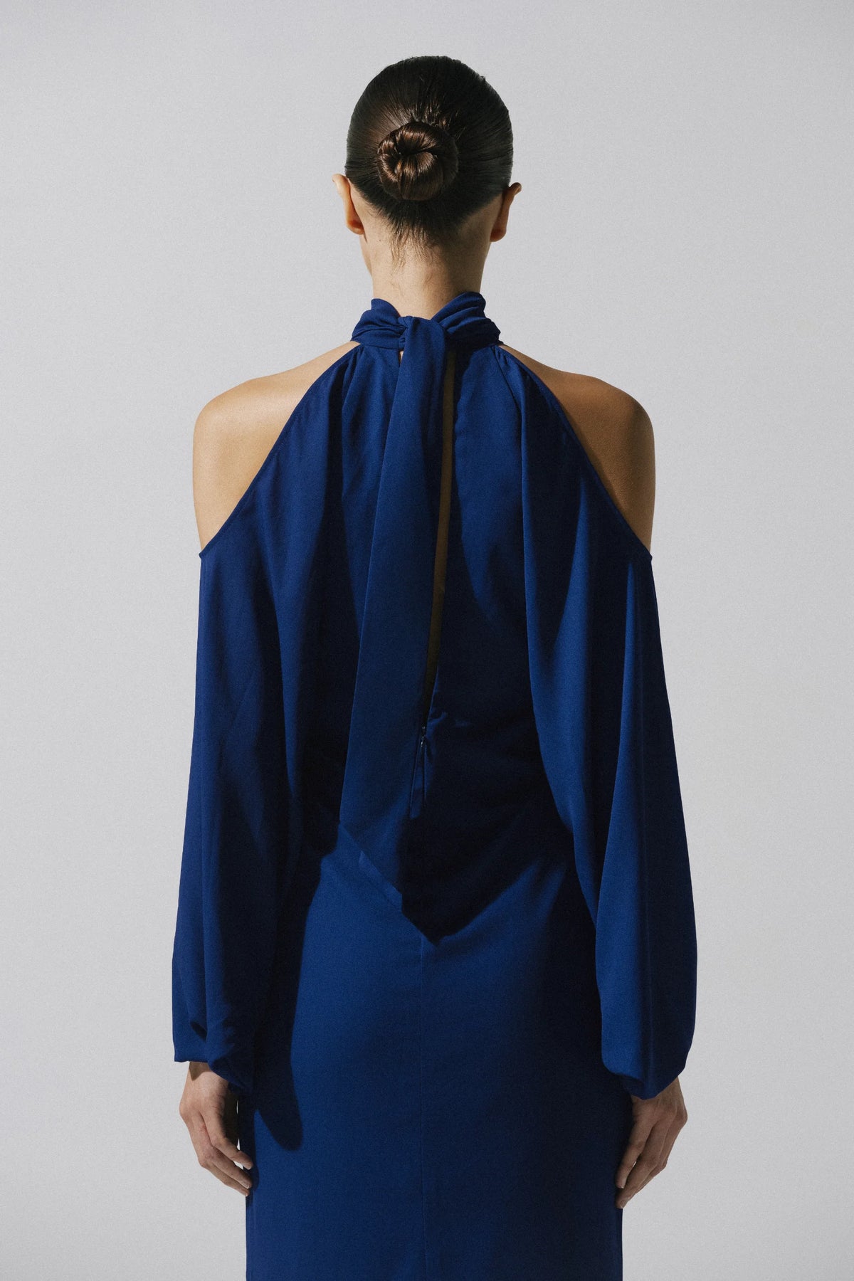 Biscay Maxi Dress by Baobab, cold shoulder and fluid fabric in deep blue tone.