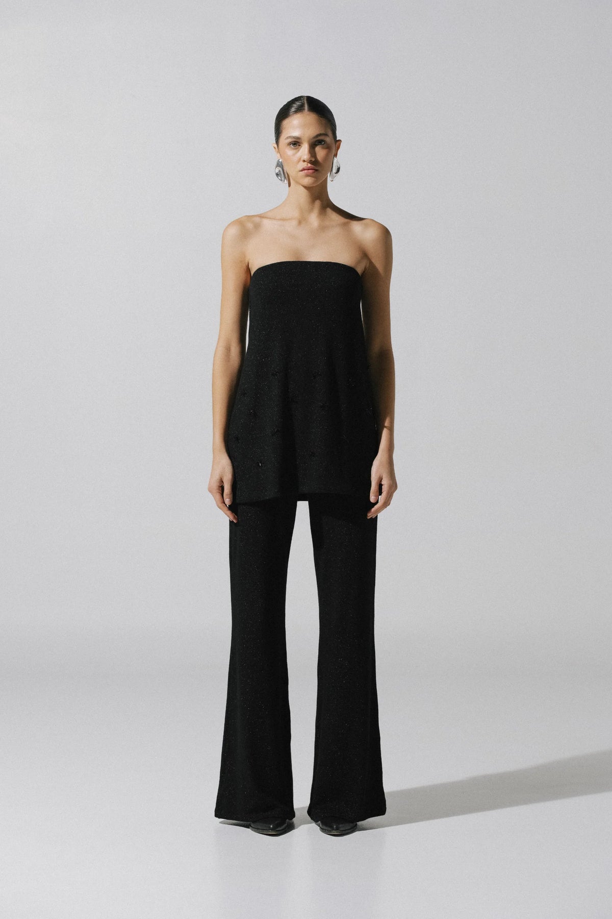 Suzu Top by Baobab, black Glossy fabric with Embellished detail, elegant and structured style.
