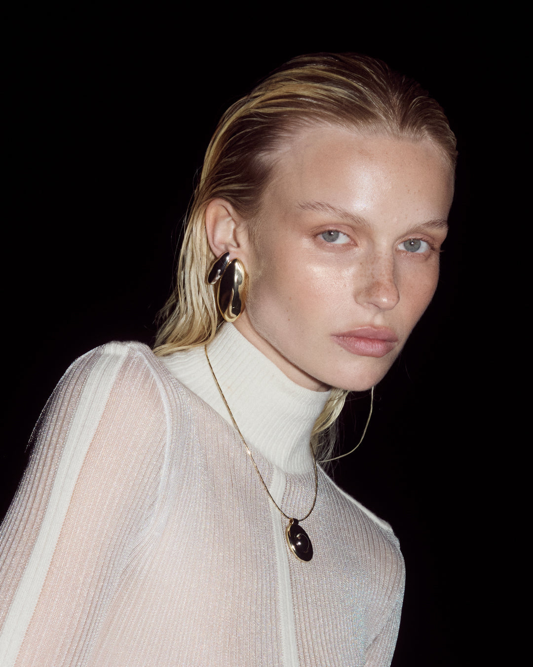 The XL Chrome Orb Studs on Model