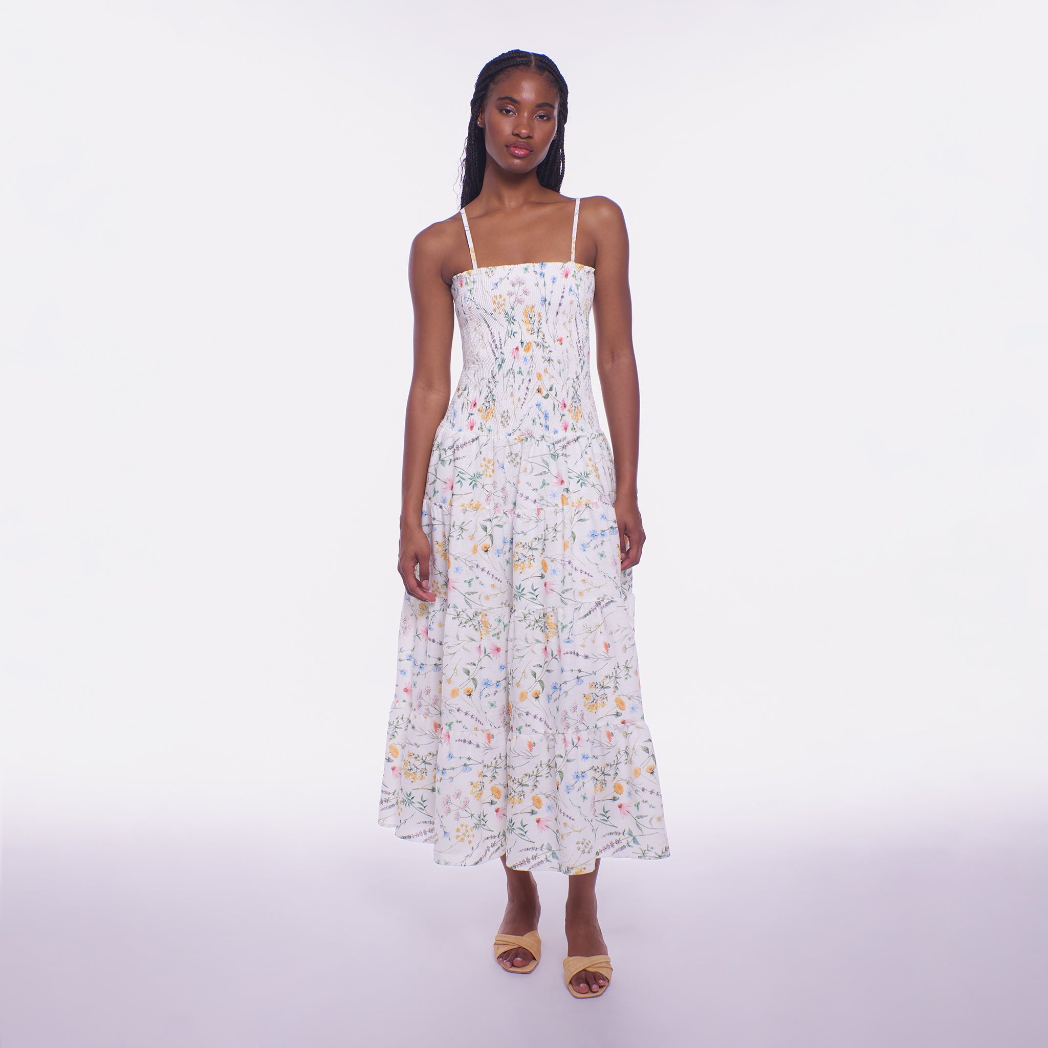 Woman wearing a floral dress on a white background