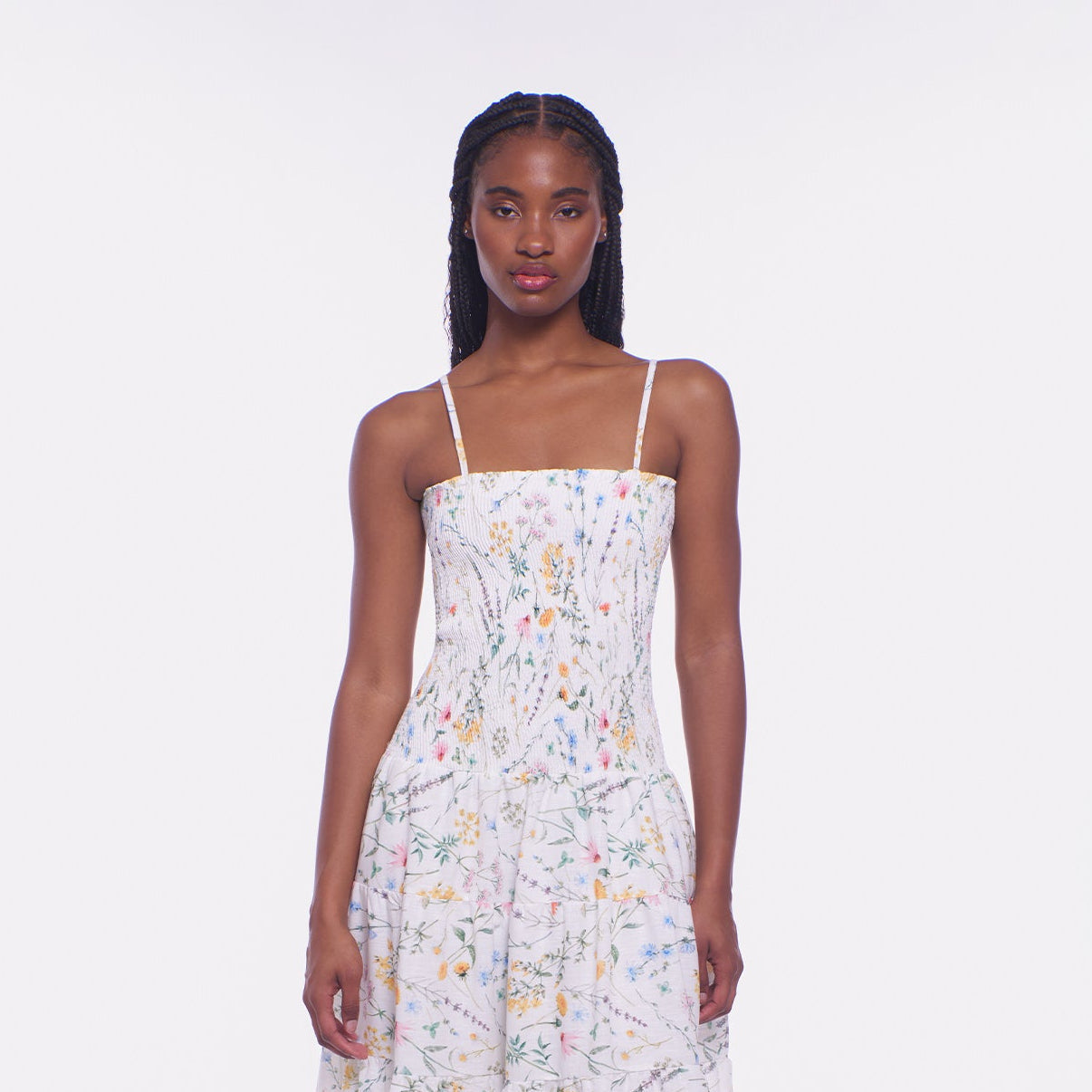 Woman wearing a floral dress on a white background
