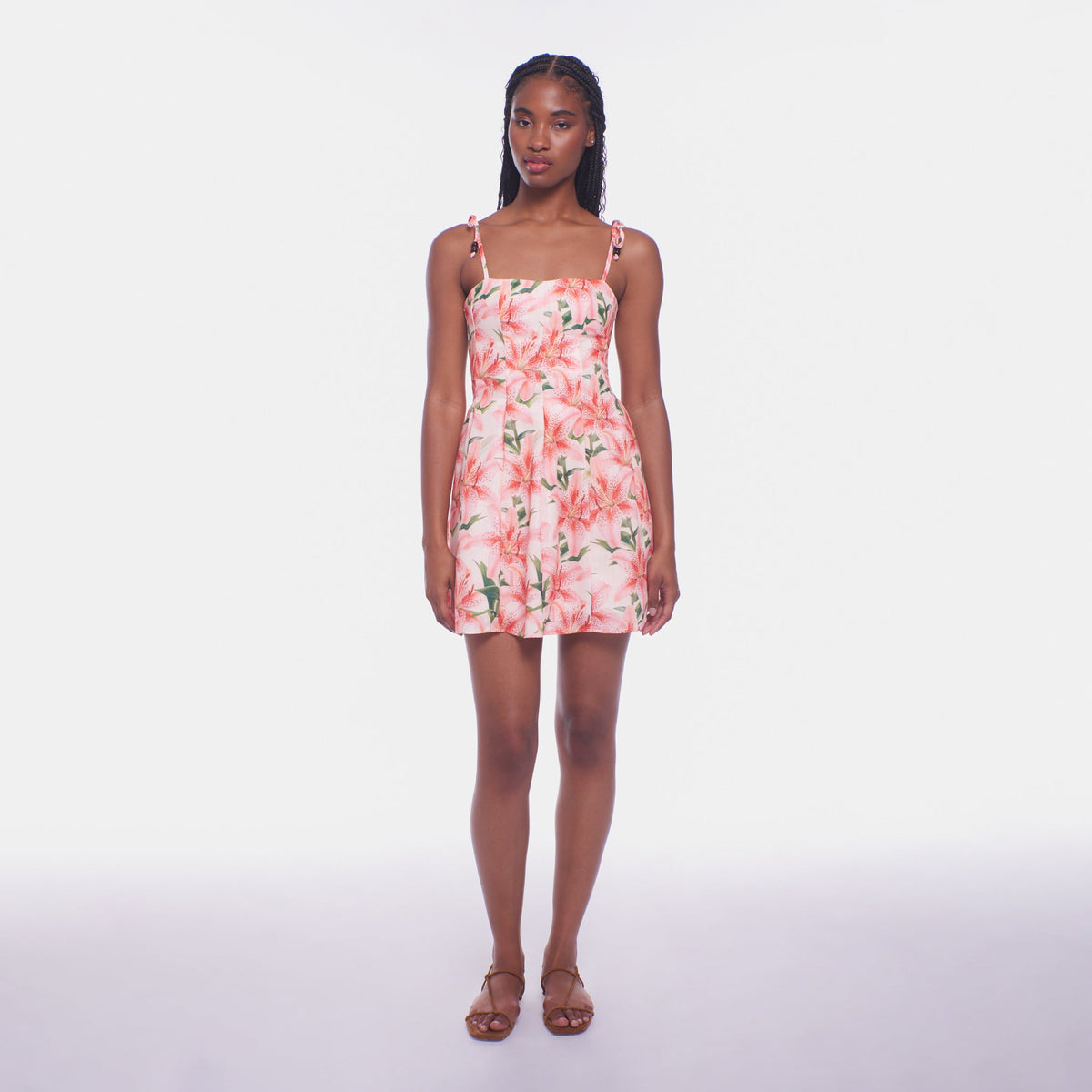 Woman wearing a floral dress on a white background