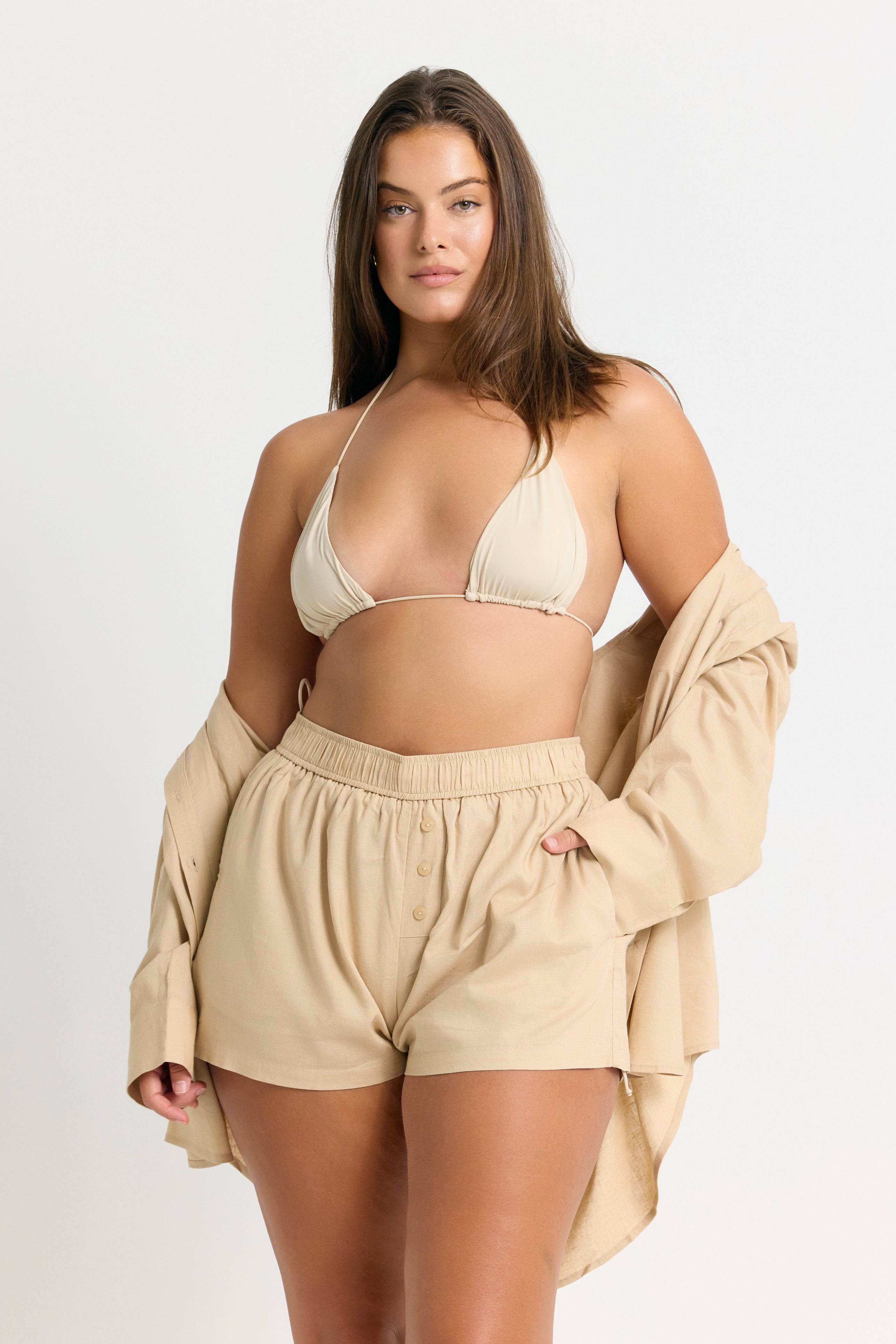 RIOT SWIM Bixi Top in Coconut, a stylish sleeveless top with a fitted design, featuring a soft fabric and casual neckline.