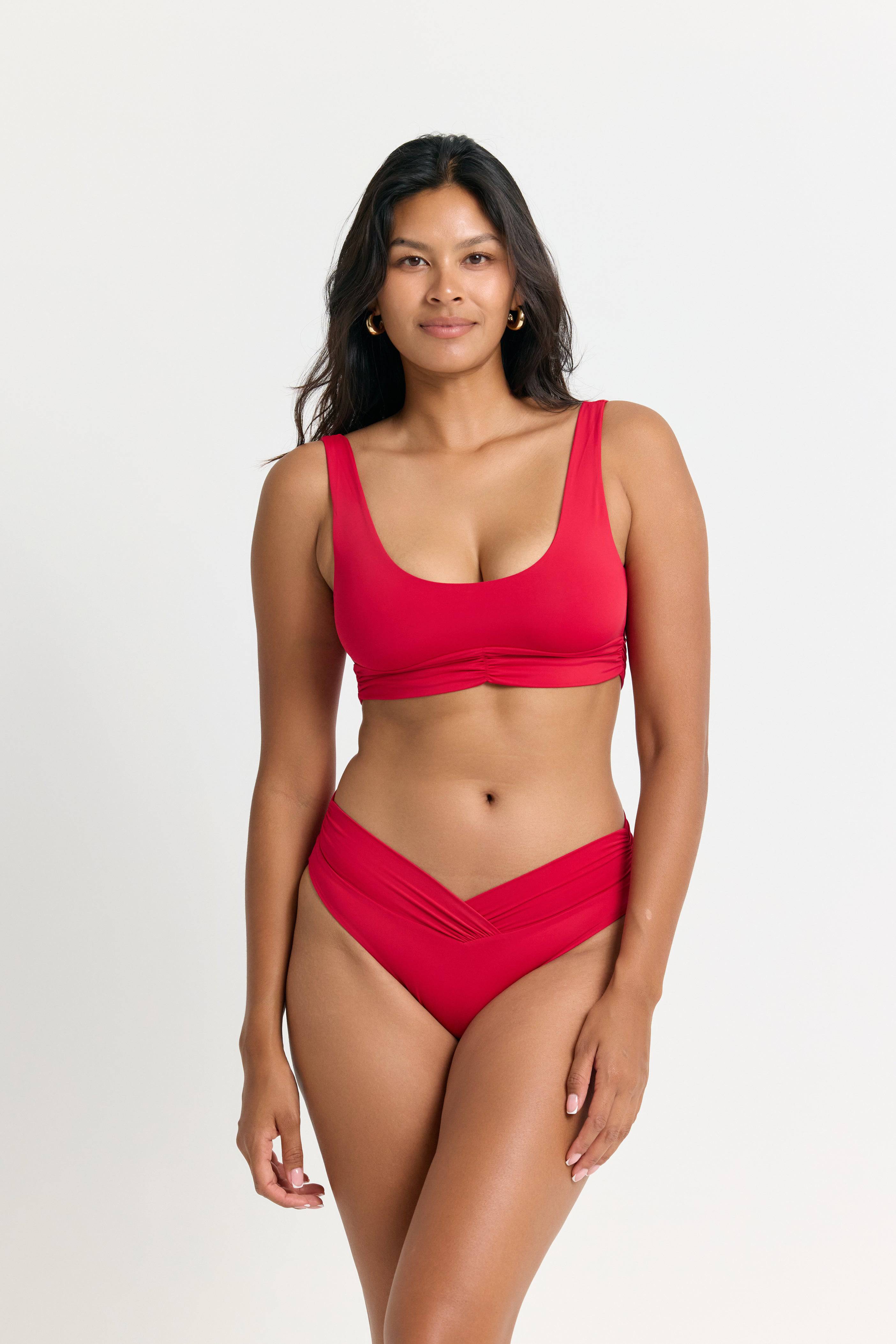 RIOT SWIM Pico high waist bottom in fire red, showcasing stylish swimwear with a high waist design and vibrant color.