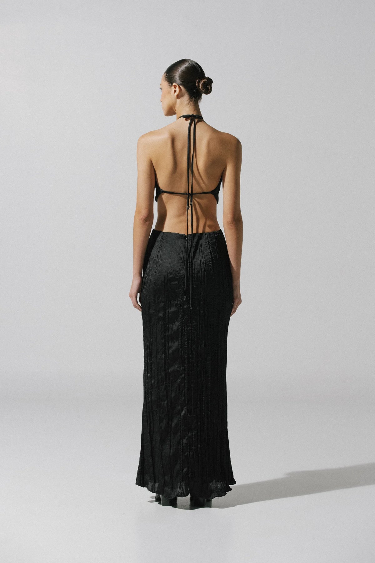 Detail of the Lexi Dress by Baobab, Pleated texture and Baobab hardware at neckline.