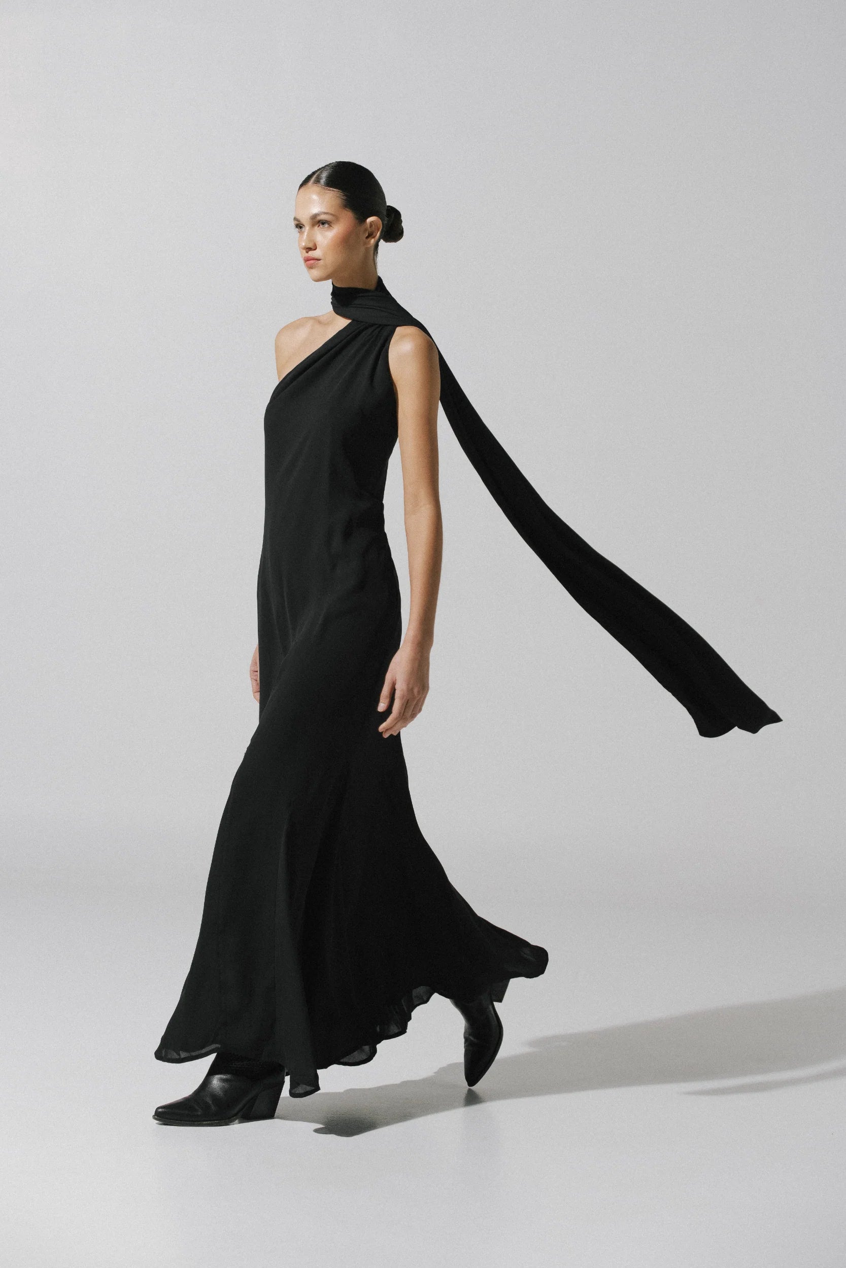 Ari Maxi Dress by Baobab in black color, One-Shoulder with Scarf detail and Godets in hemline.