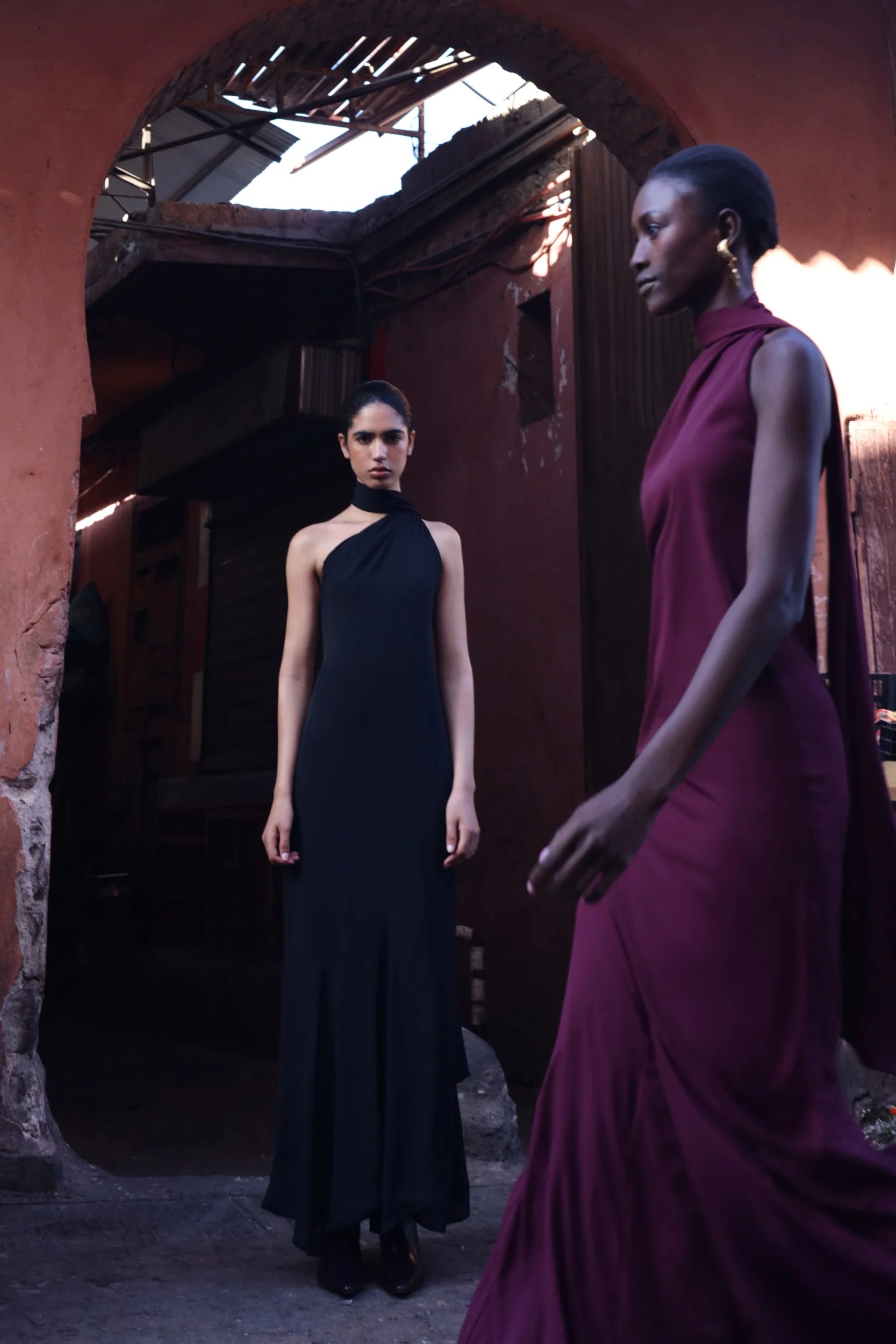 Black Ari Dress with Open back, Scarf detail and structured fall.
