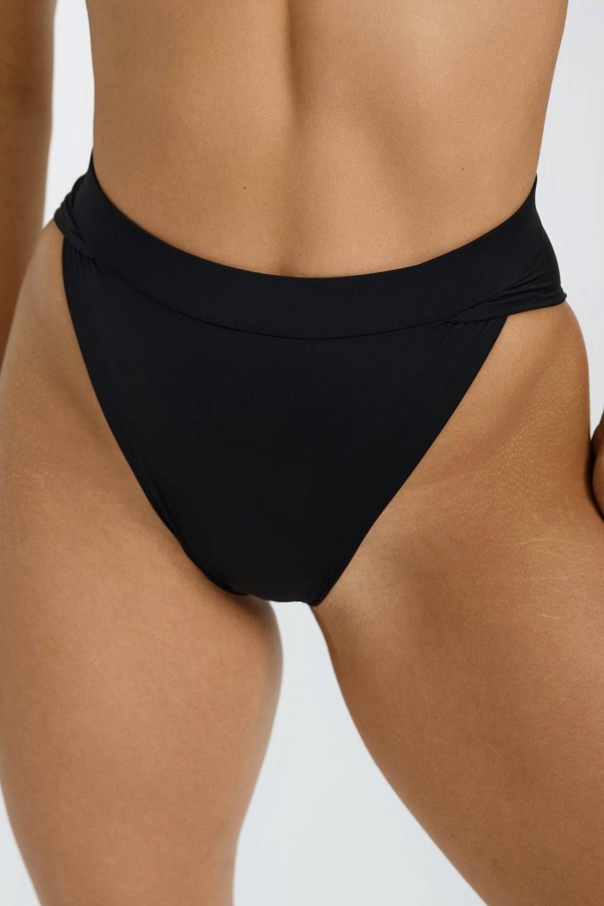 Black Vista Bottom from Riot Swim, high-waisted bikini bottom with a sleek fit, designed for stylish swimwear.