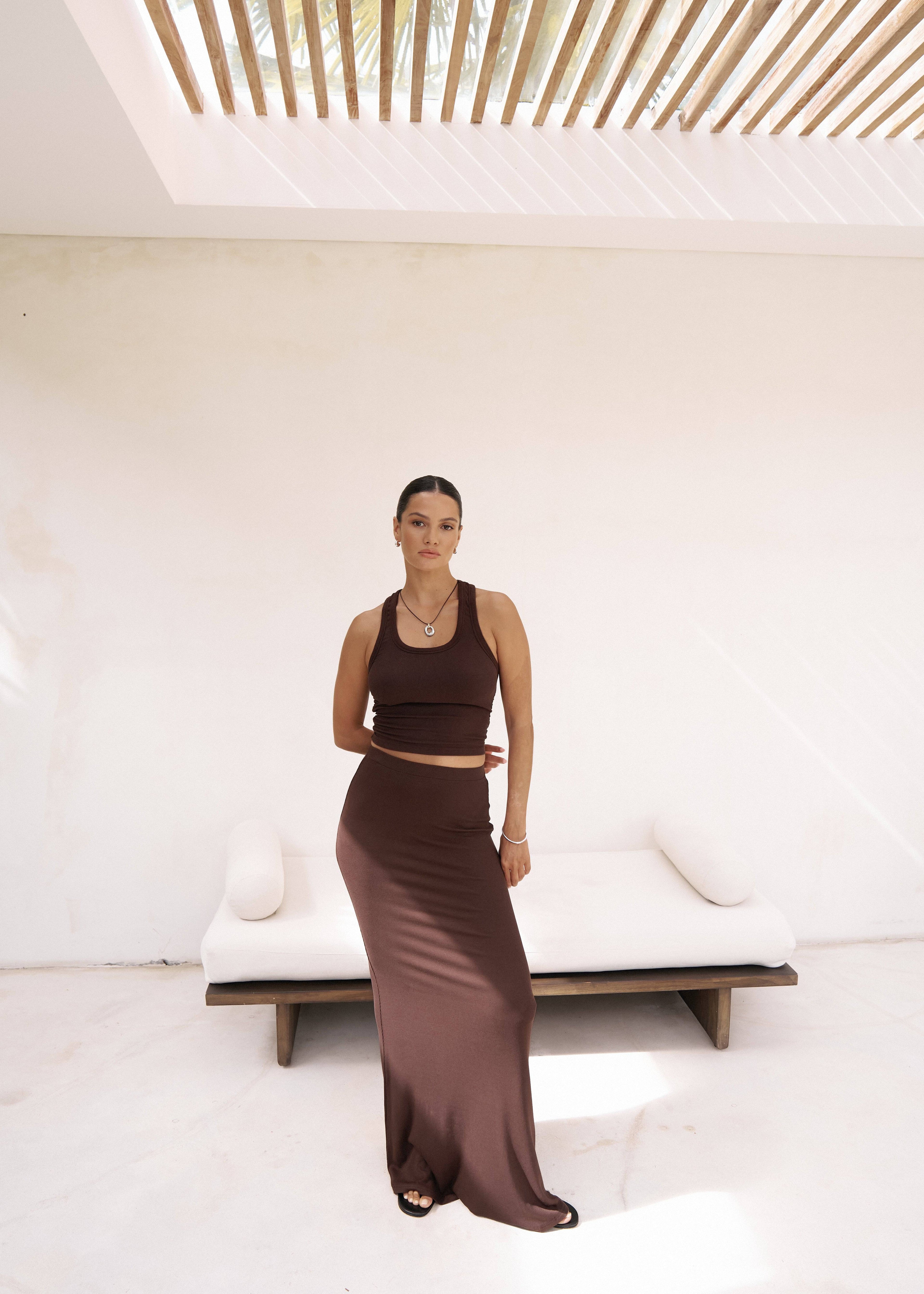 Riot Lounge Dom Maxi Skirt in chocolate, flowing long skirt with waistband, styled for casual or dressy occasions.
