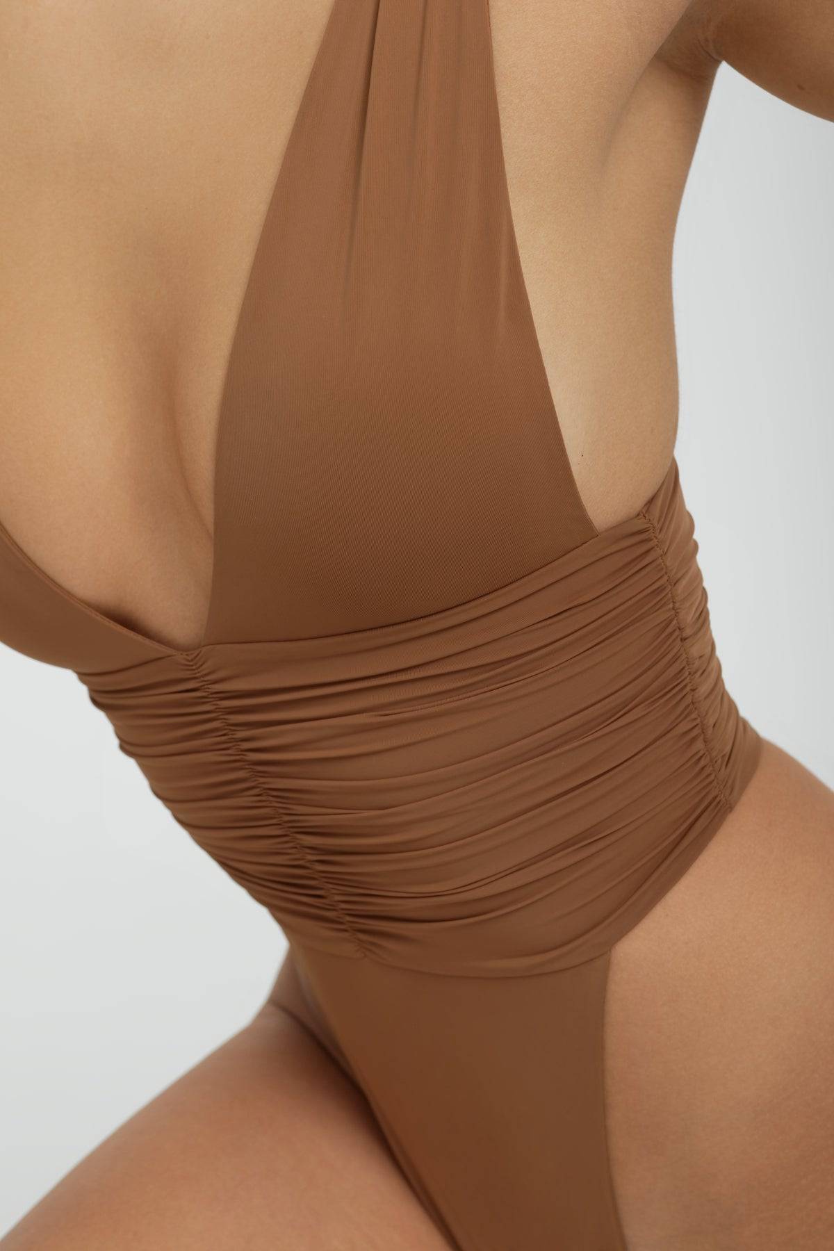 RIOT SWIM Echo One Piece Minimal swimsuit in Brown Sugar, showcasing a sleek, minimal design with smooth fabric and elegant cut.