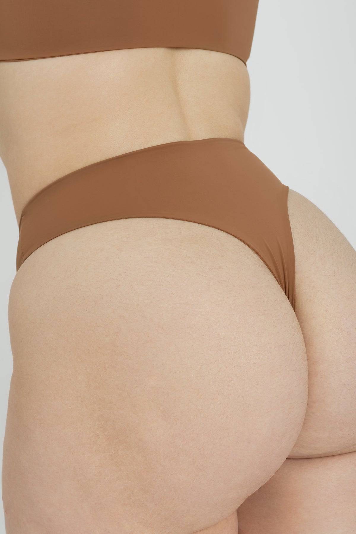 Riot Swim Kai high waist bikini bottom in Brown Sugar, featuring a stylish high-waist design and smooth fabric.