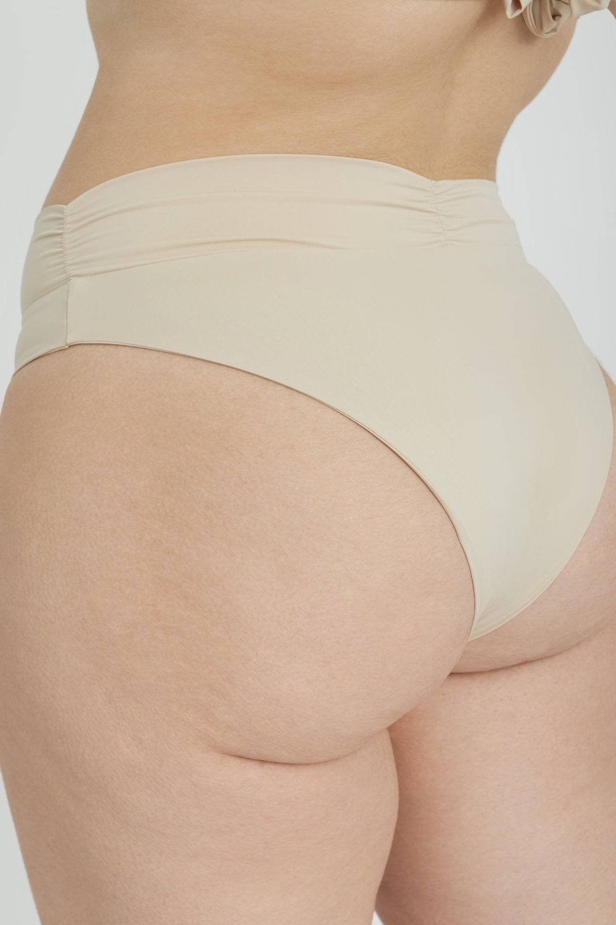 RIOT SWIM Pico high waist bikini bottom in coconut color, featuring a stylish high-rise design and smooth fabric.