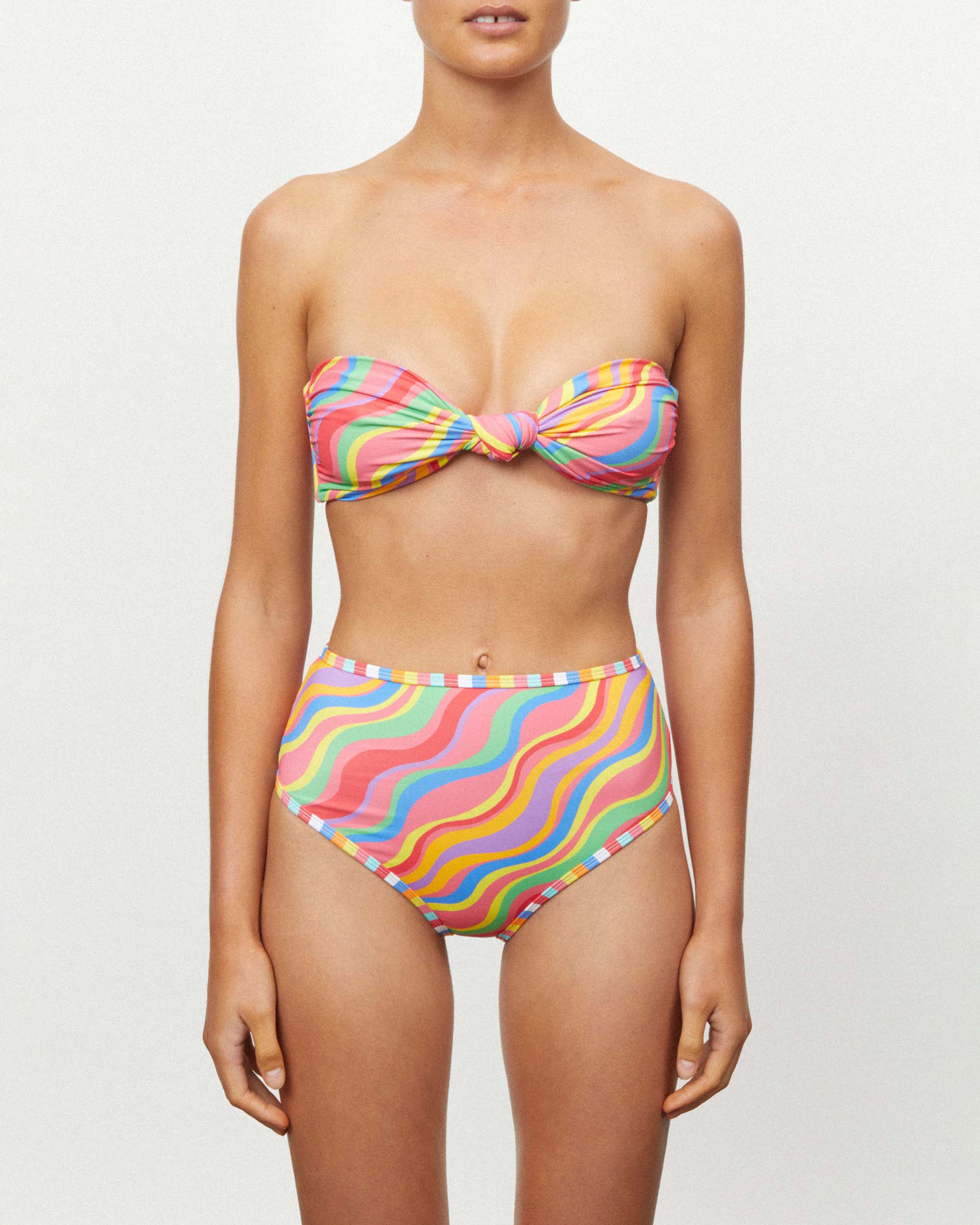 Studio image of model wearing the Waisted Duo Pant in Rainbow, featuring its mid-high leg cut and mid-high waistline. 