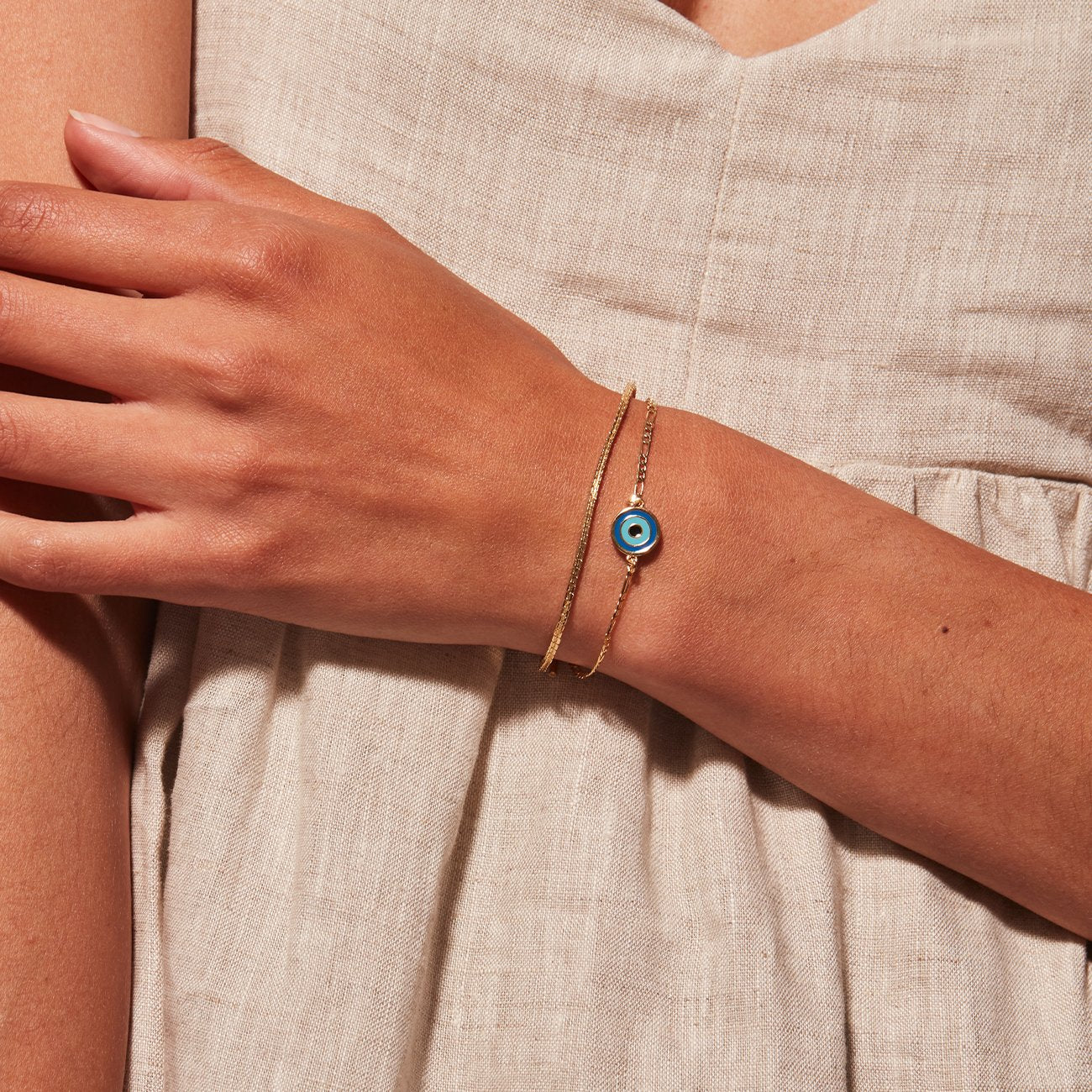 Evil Eye Bracelet in Gold on Model in a Dress