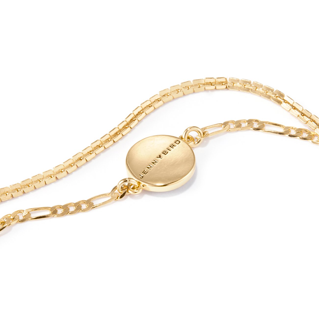 Evil Eye Bracelet in Gold Laying Flat on White Background