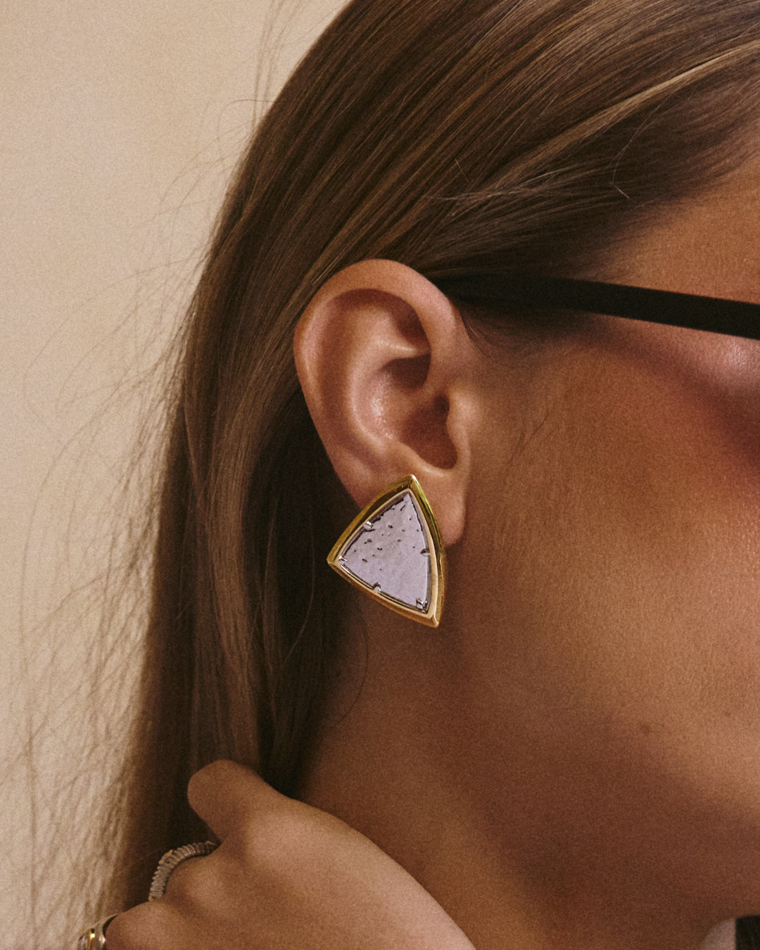 The Luv Aj Bianco Nero Studs in Gold on Model's Ear