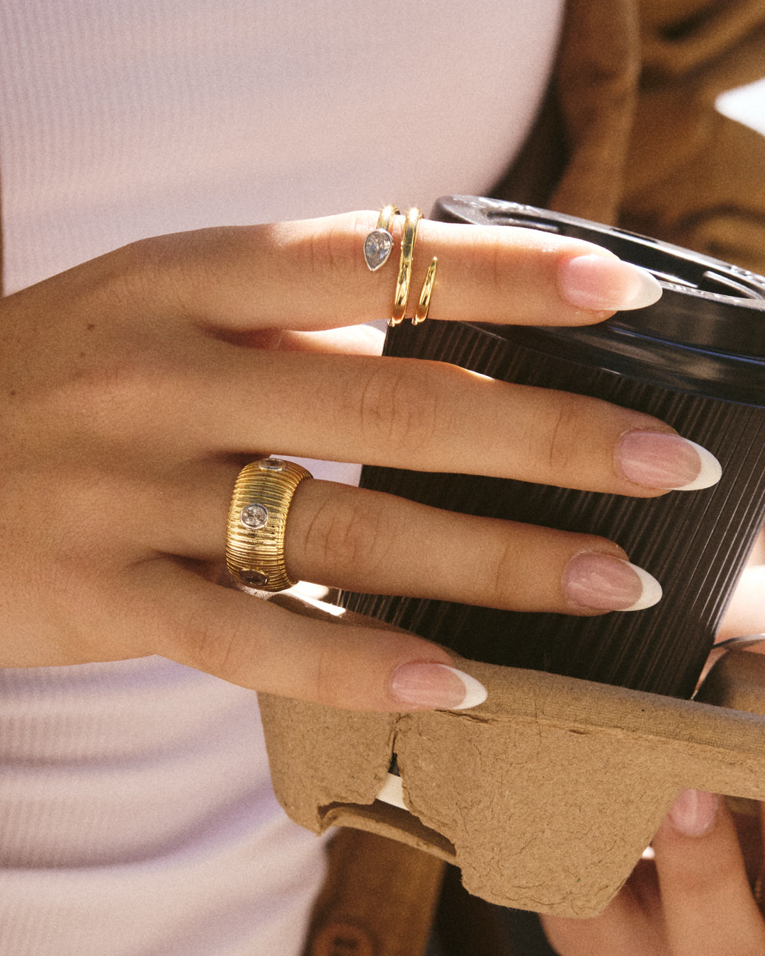 The Luv Aj Georgia Ridged Band in Gold on Models ring finger