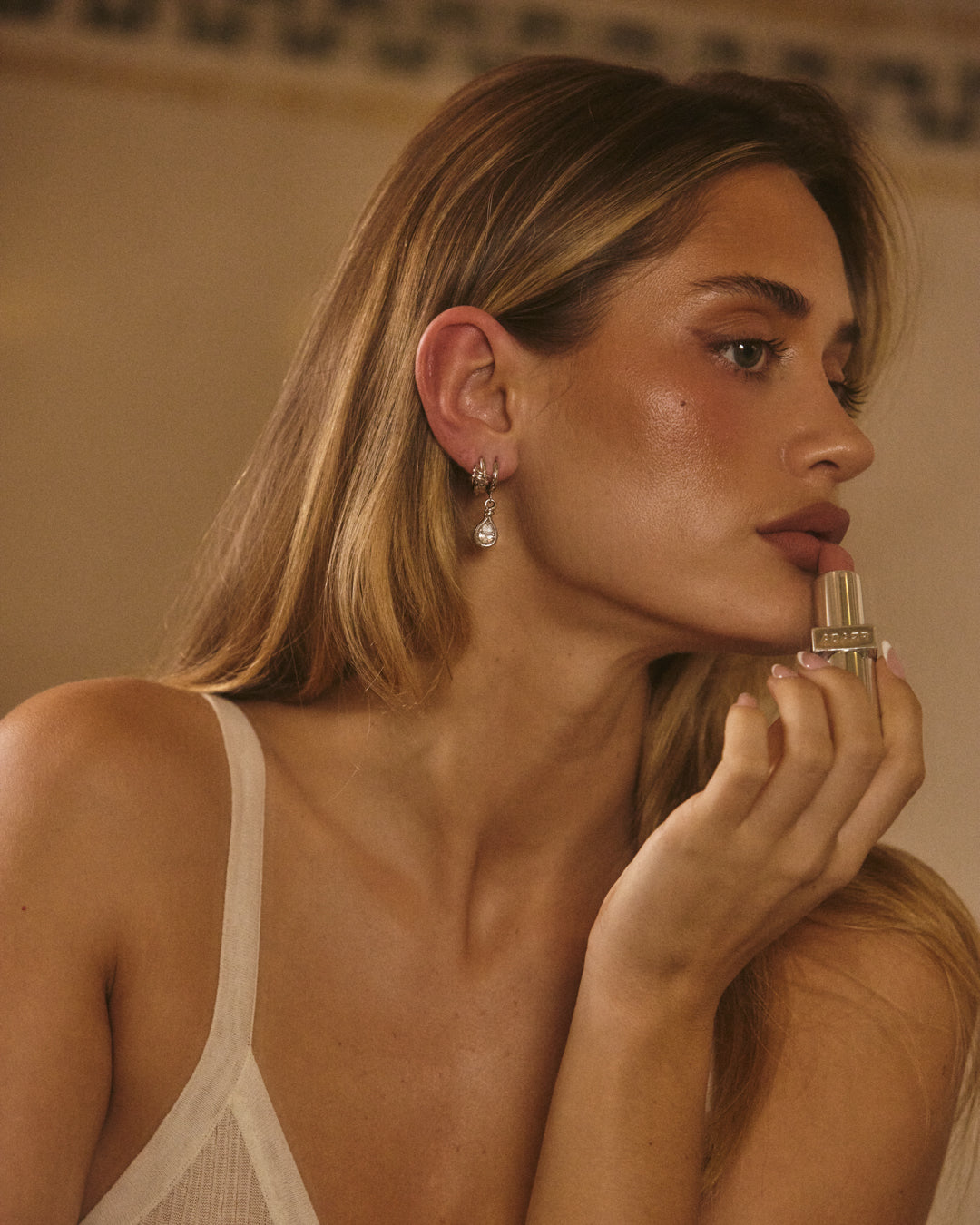 The Luv Aj Georgia Stone Knot Hoops in silver on Model