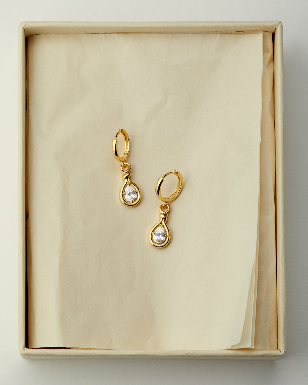 The Luv Aj Georgia Stone Knot Hoops flat lay