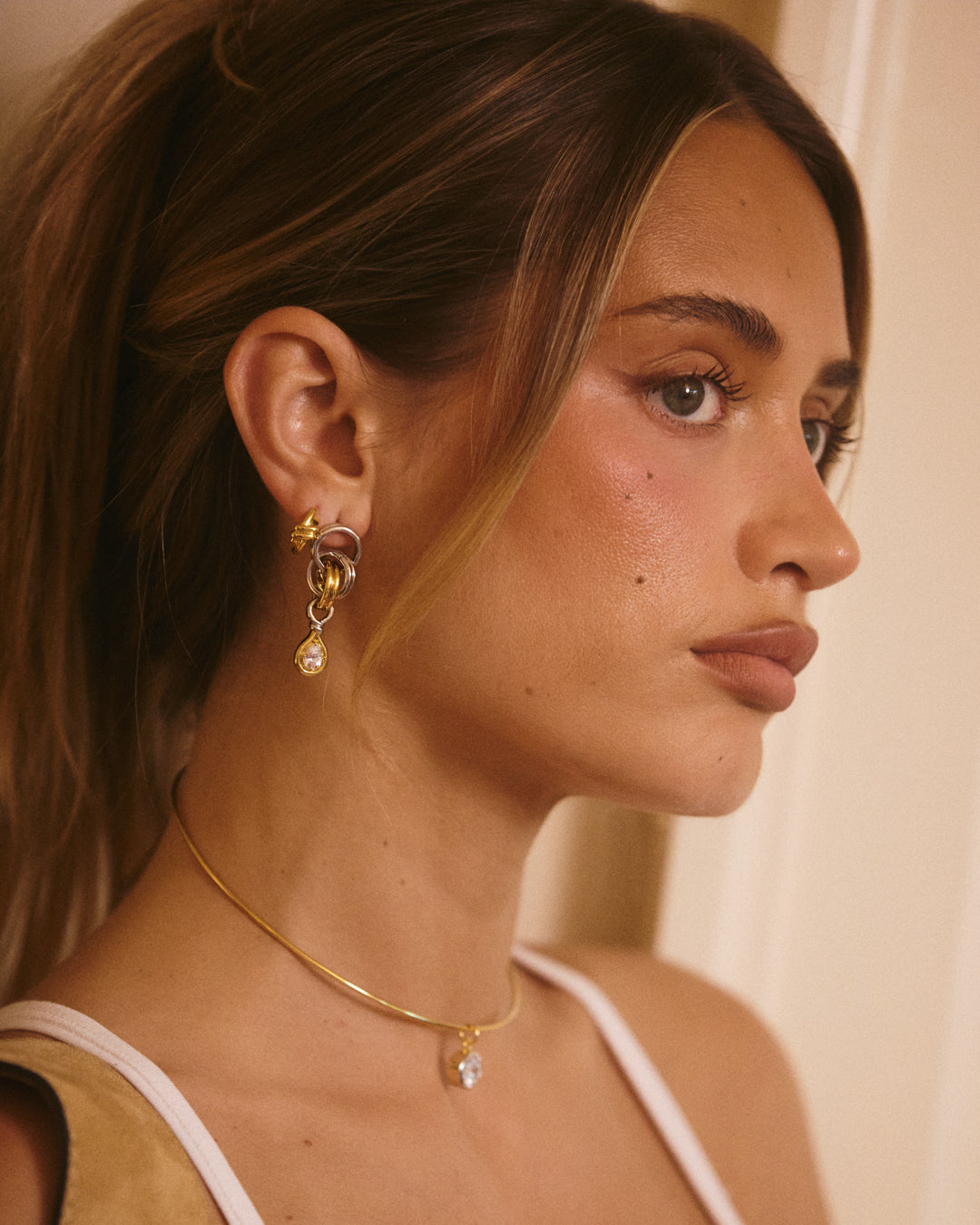 The Luv Aj Georgia Stone Twisted Studs in Gold on Model