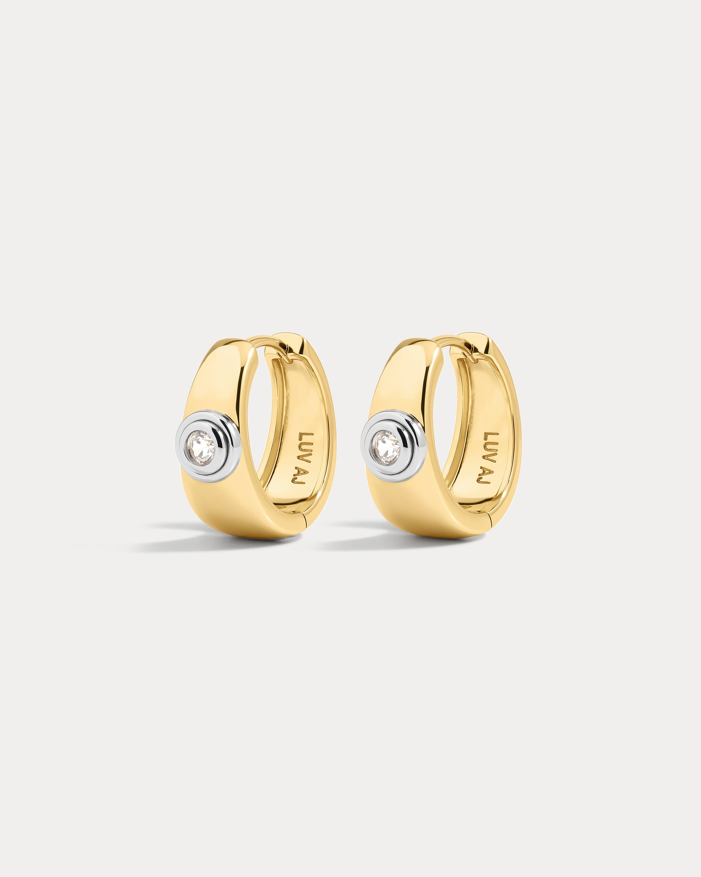 The Luv Aj Luna Bezel Hoops in Gold on white background