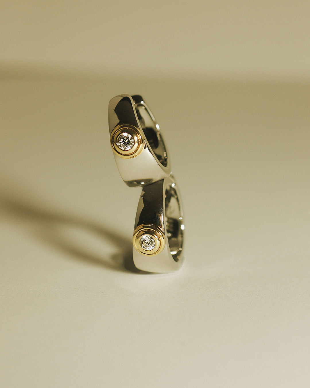The Luv Aj Luna Bezel hoops in silver, stacked