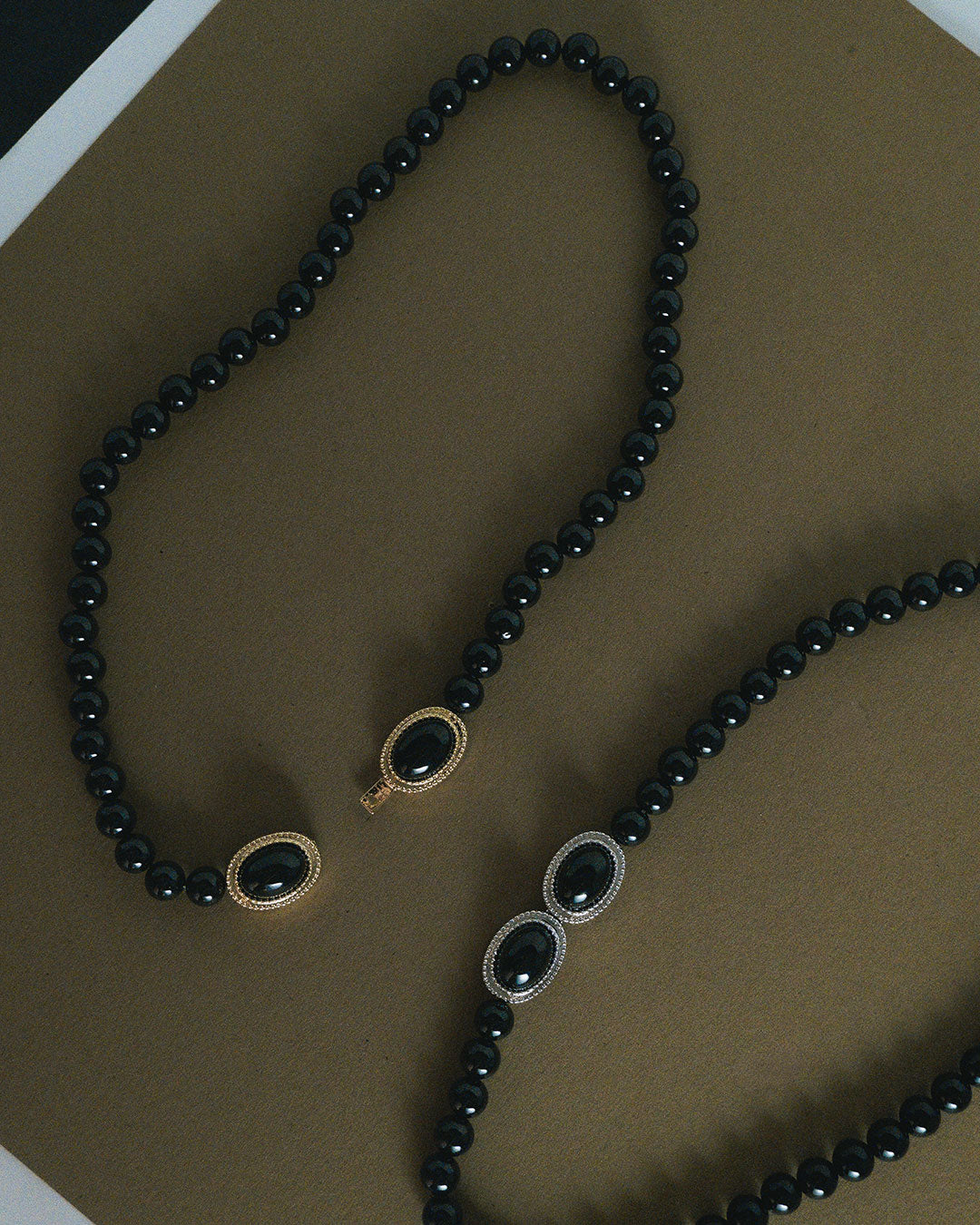 The Luv Aj Midnight Mesa Beaded Necklace in Gold and Silver on Green background