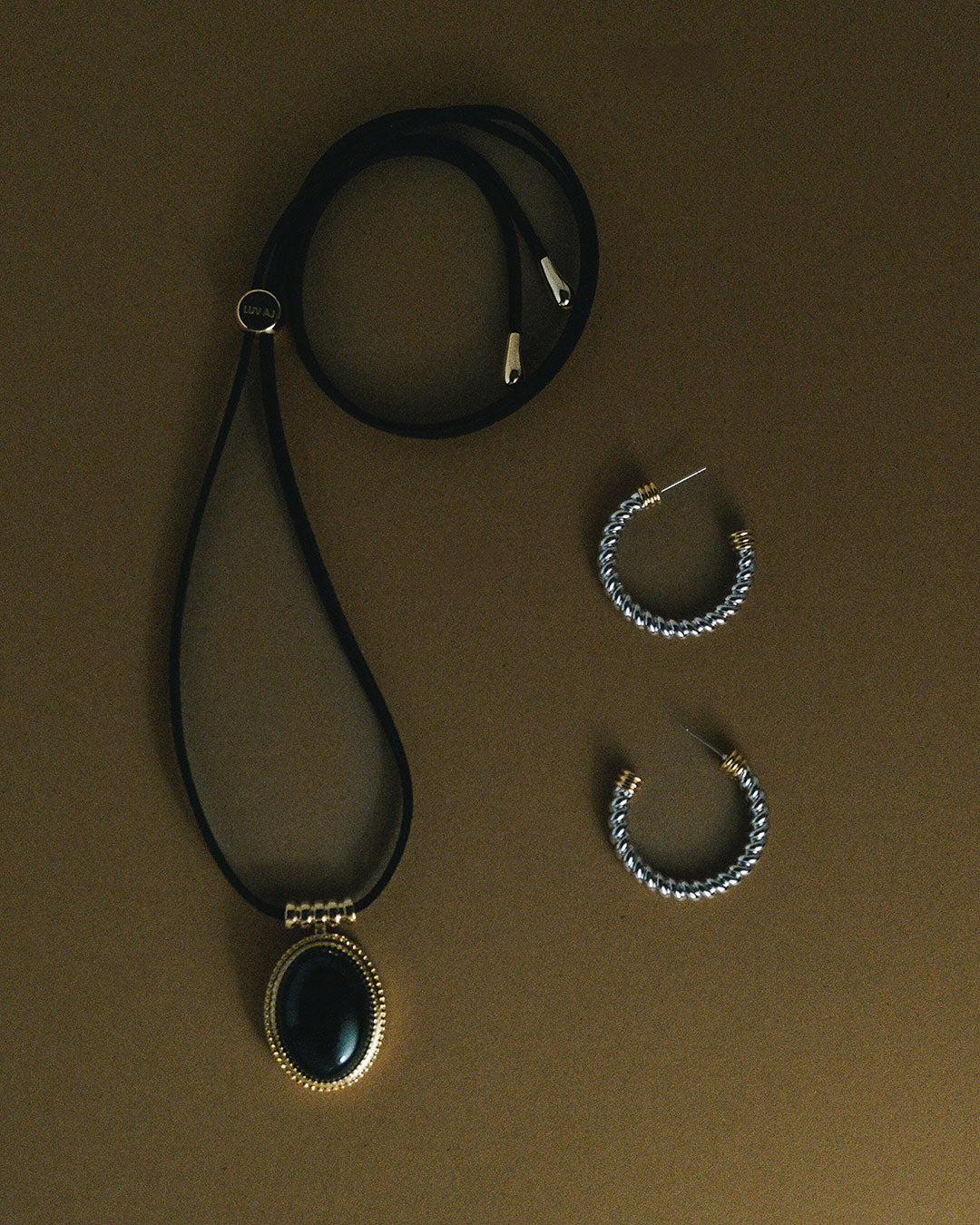 The Luv Aj Midnight Mesa Cord Necklace in Gold on flat background