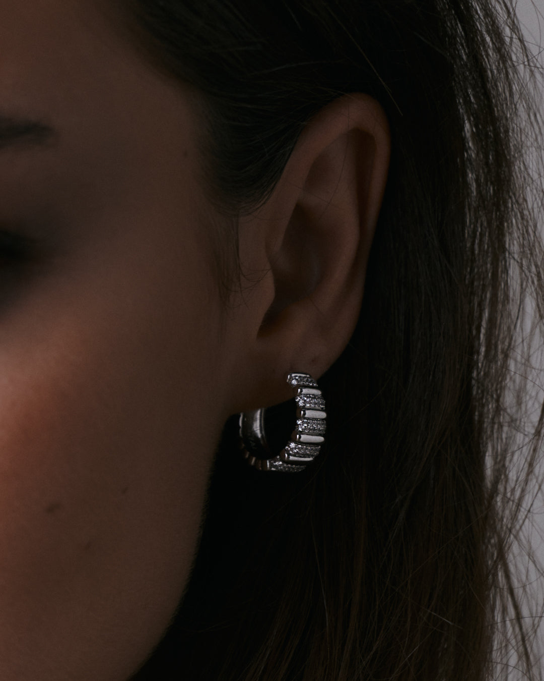 The Luv Aj Pave Marbella Ridged hoops in silver on model