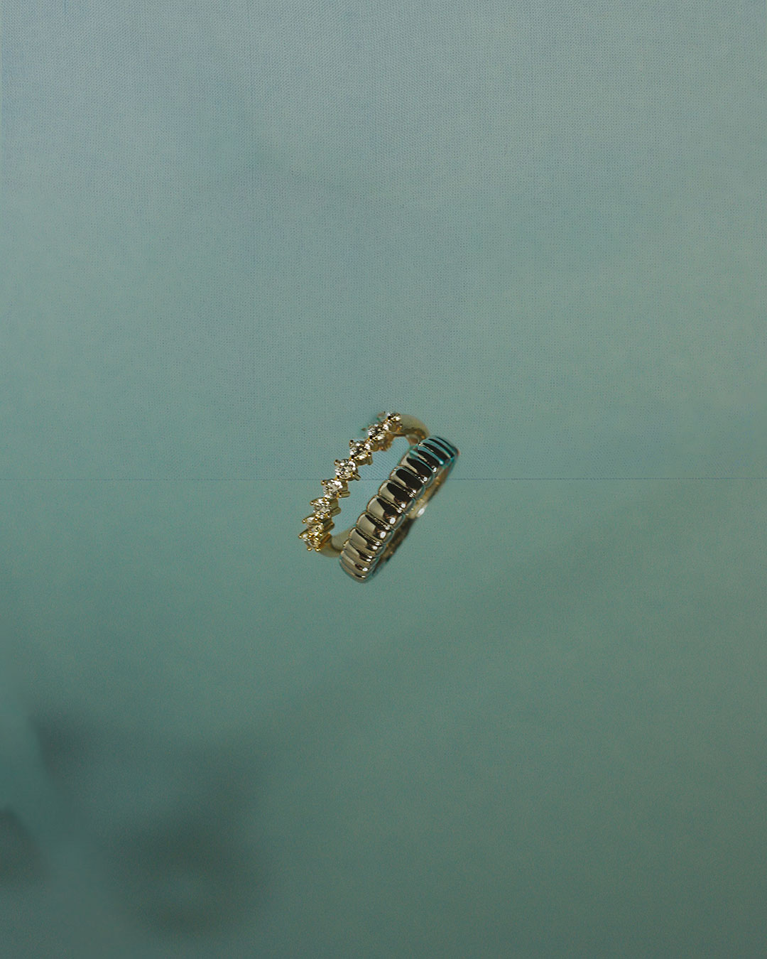 The Luv Aj Sierra Split Ring on sea-foam green background