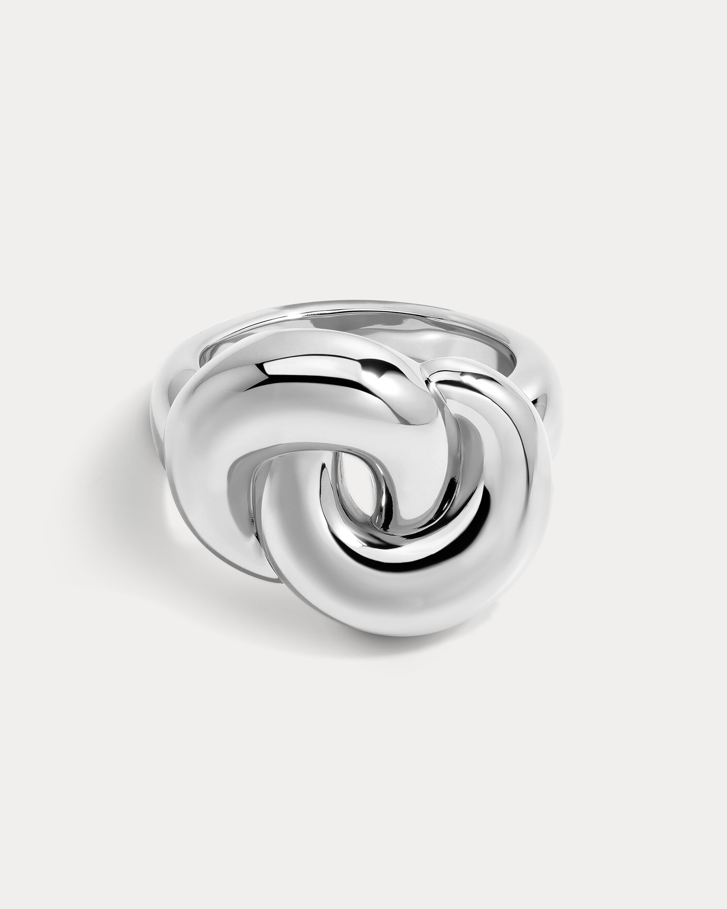The Luv Aj Solstice Knot Ring in Silver on white background