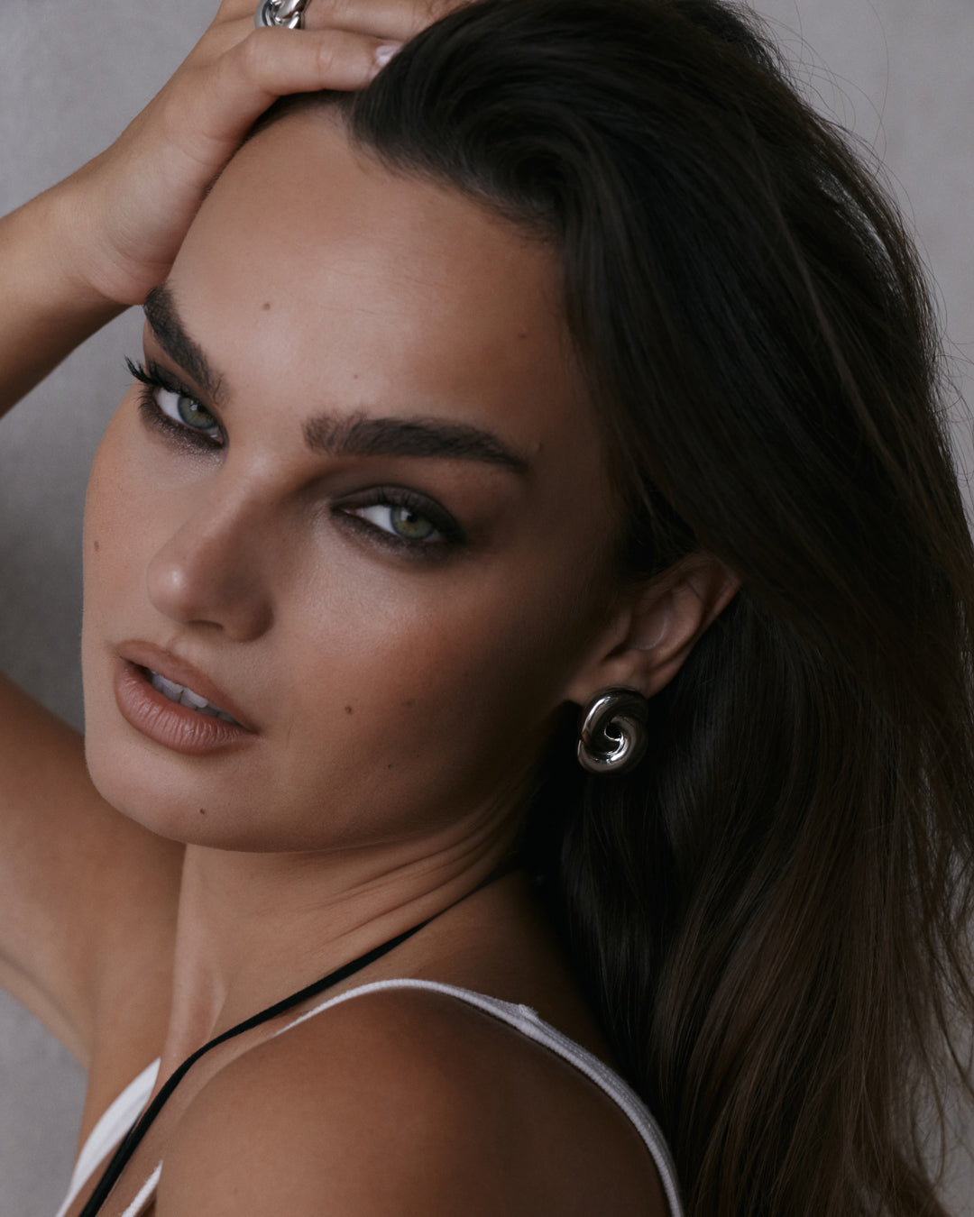 The Luv Aj Solstice Knot Studs in Silver on Model