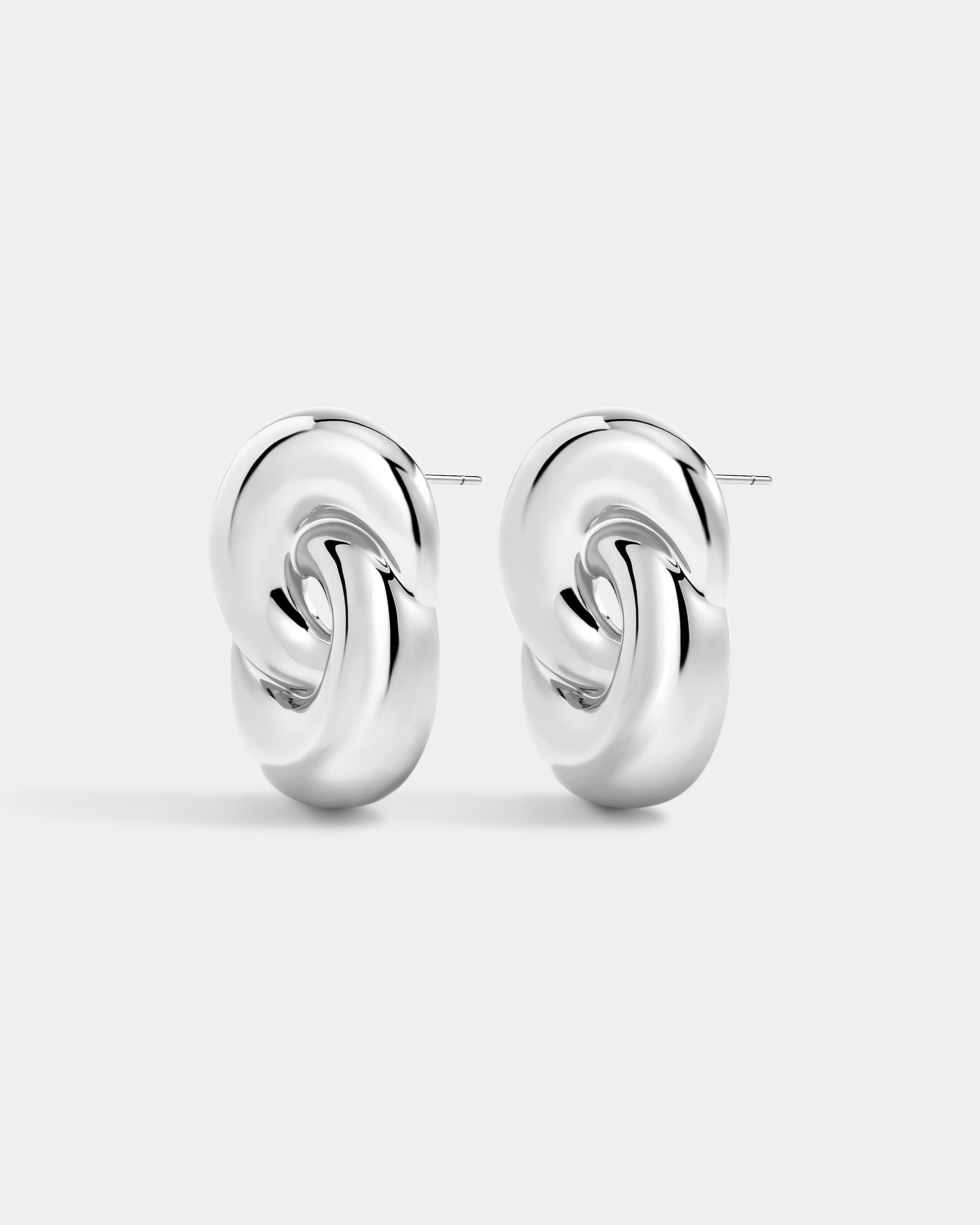 The Luv Aj Solstice Knot Studs in Silver on White Background