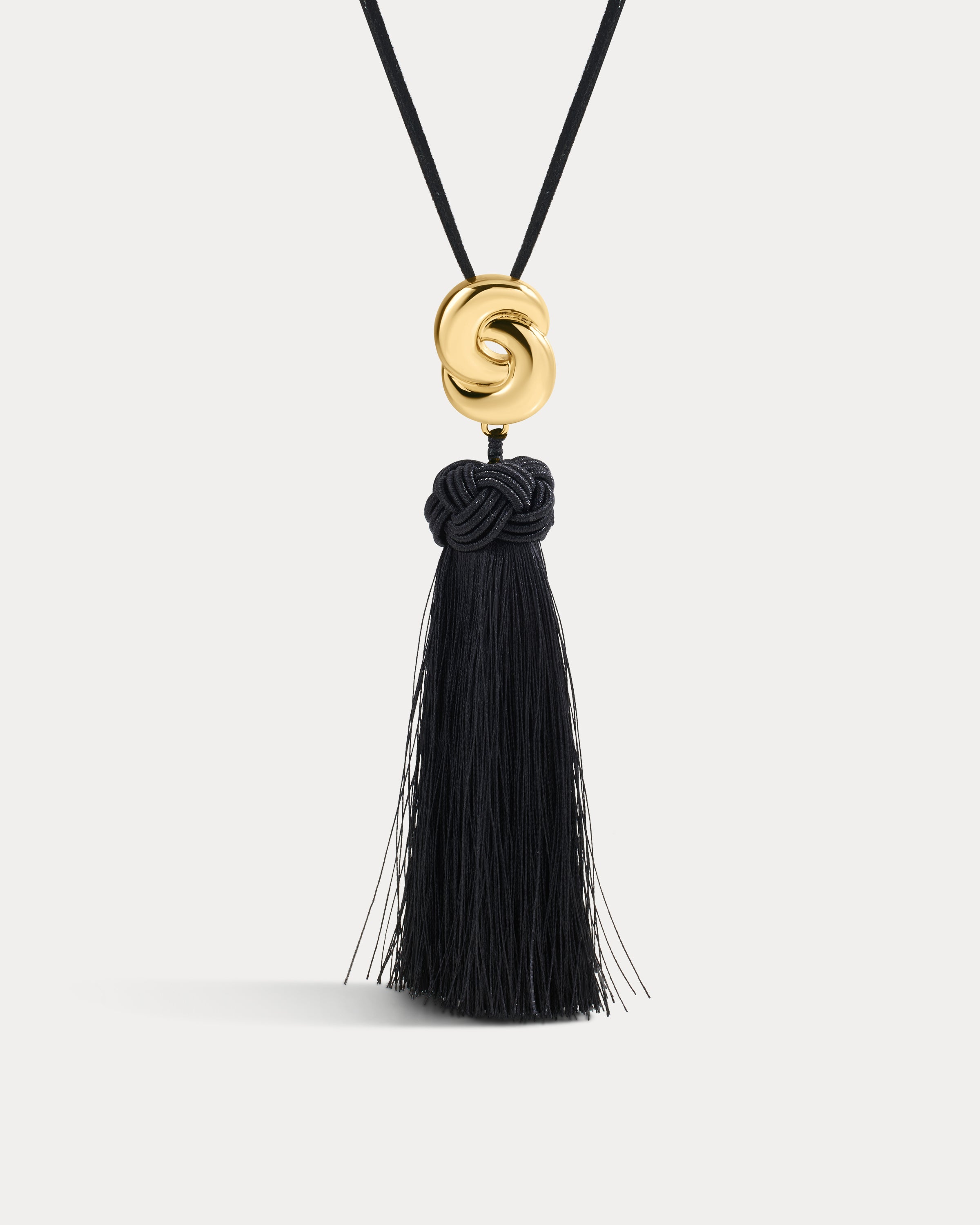 The Luv Aj Solstice Knot Tassel Necklace in Gold on White Background