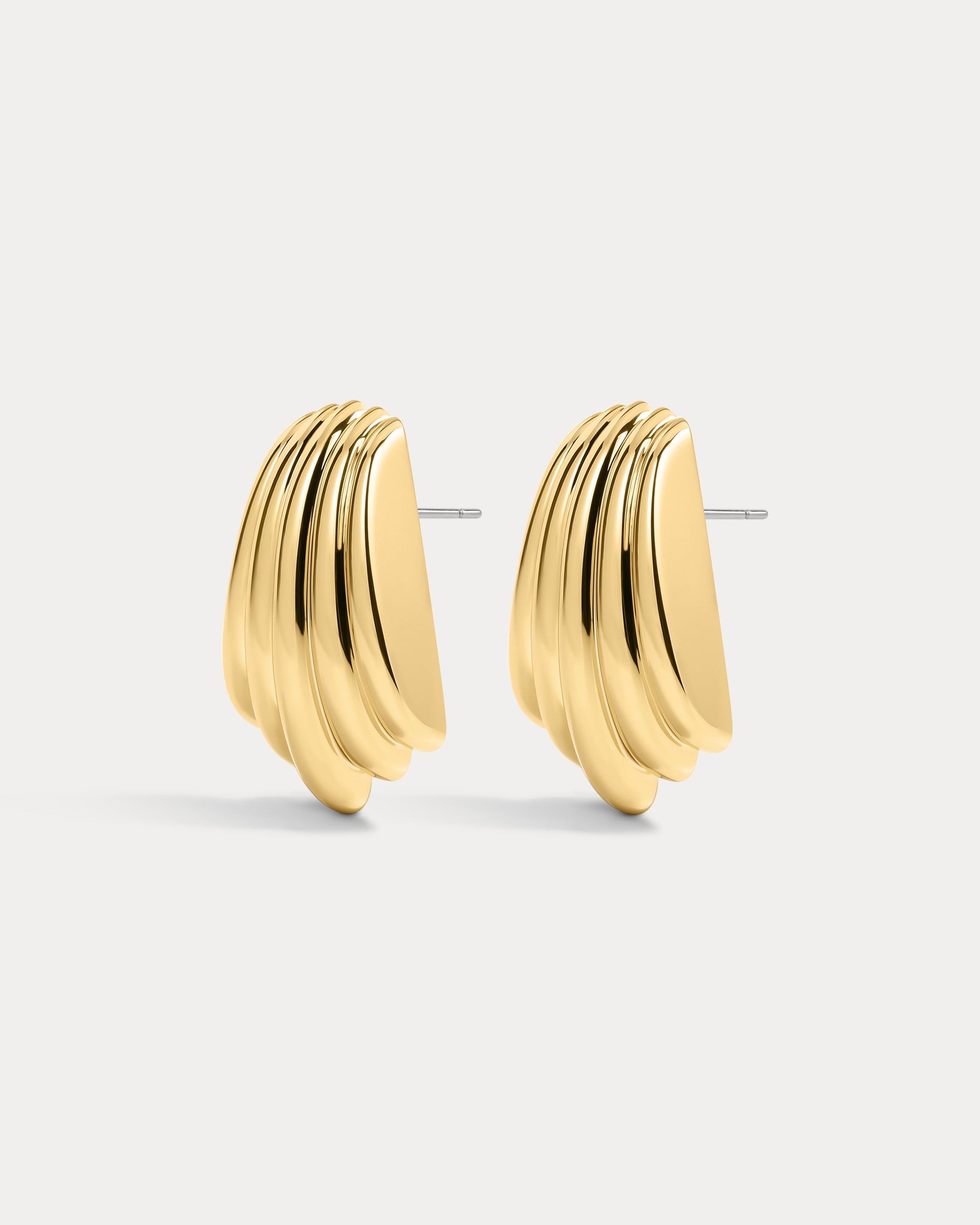 The Luv Aj Sundown Statement studs in gold on white background