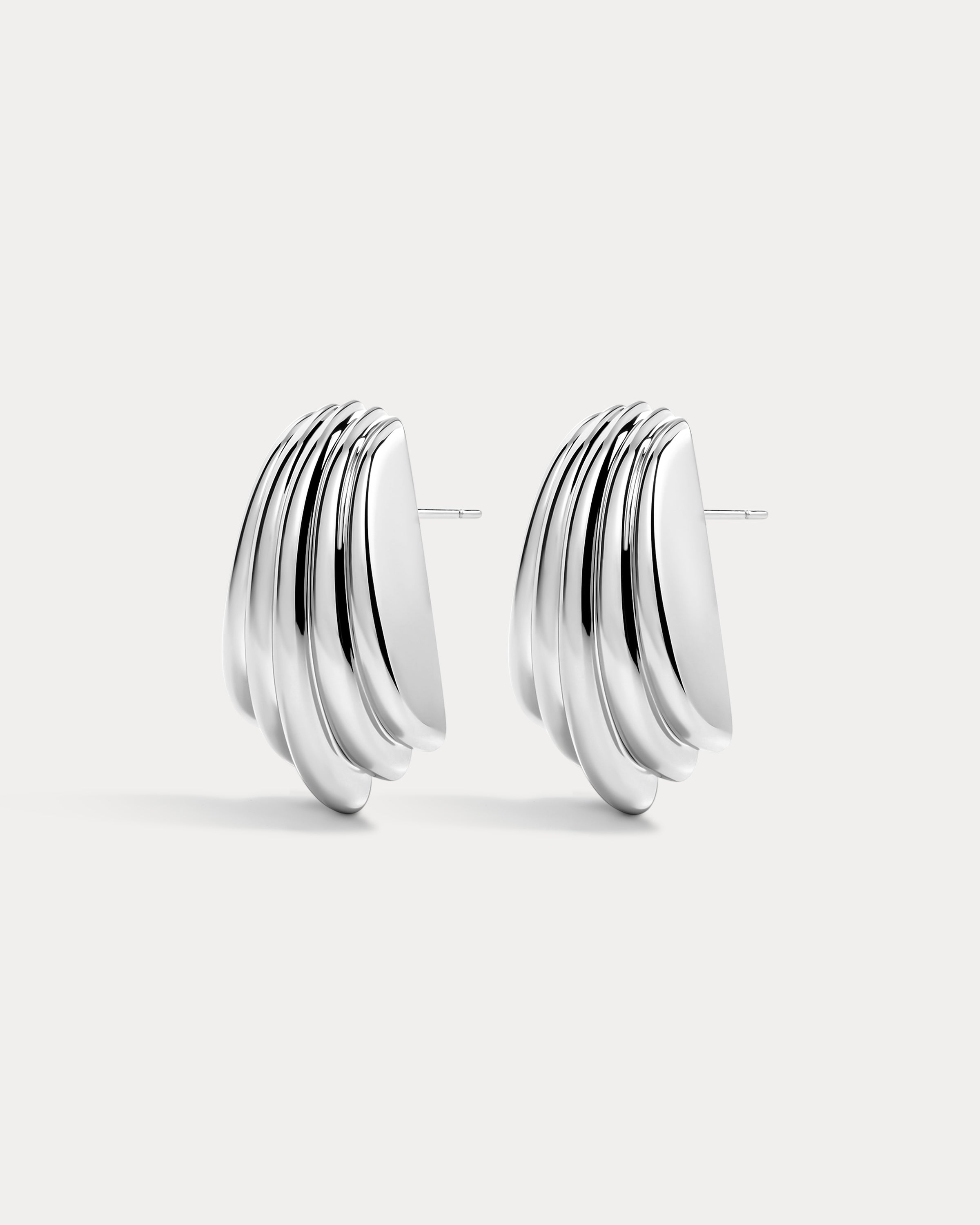 The Luv Aj Sundown Statement Studs in silver on white background