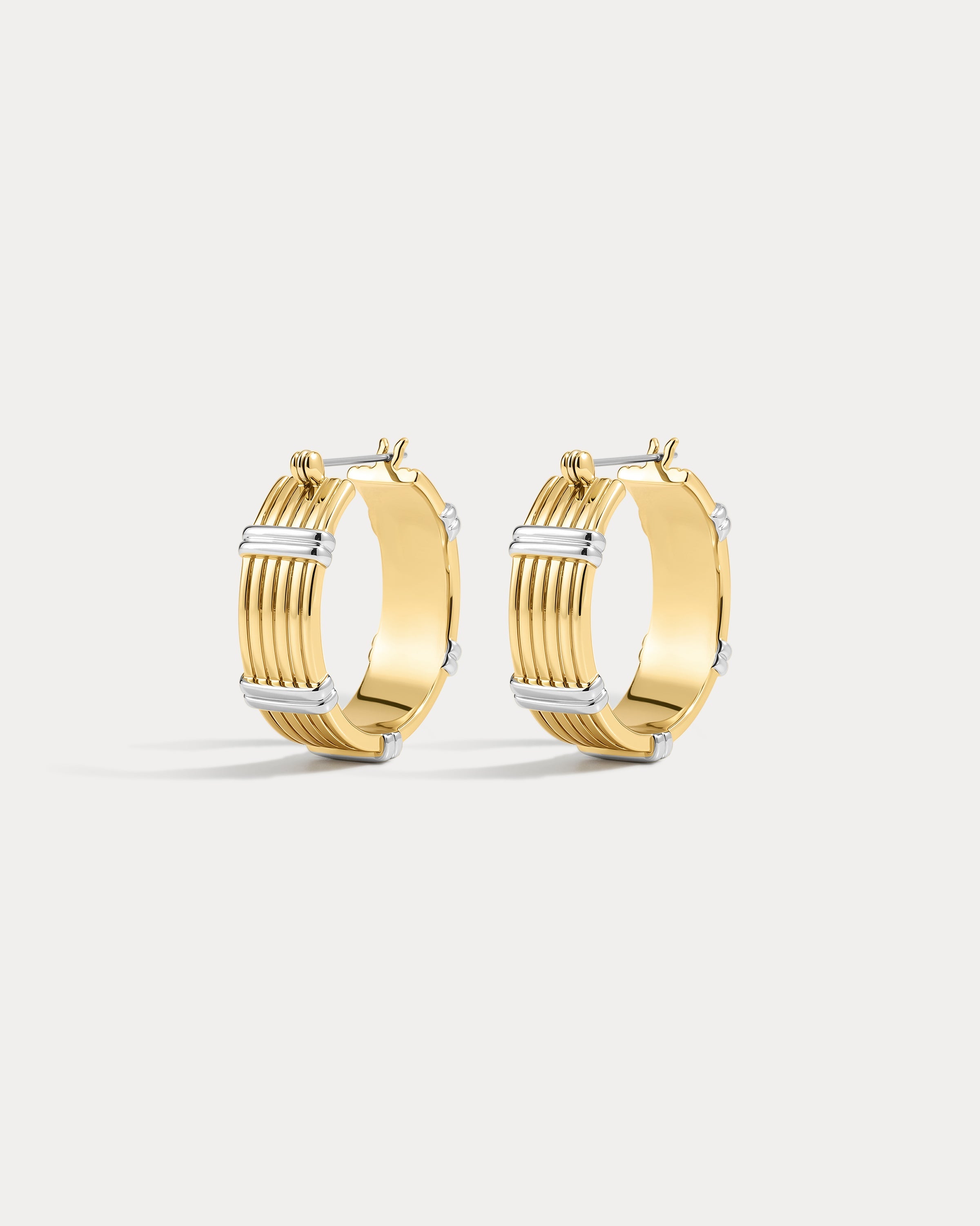 The Luv Aj Two Tone Sierra Bar Hoops in gold on white background