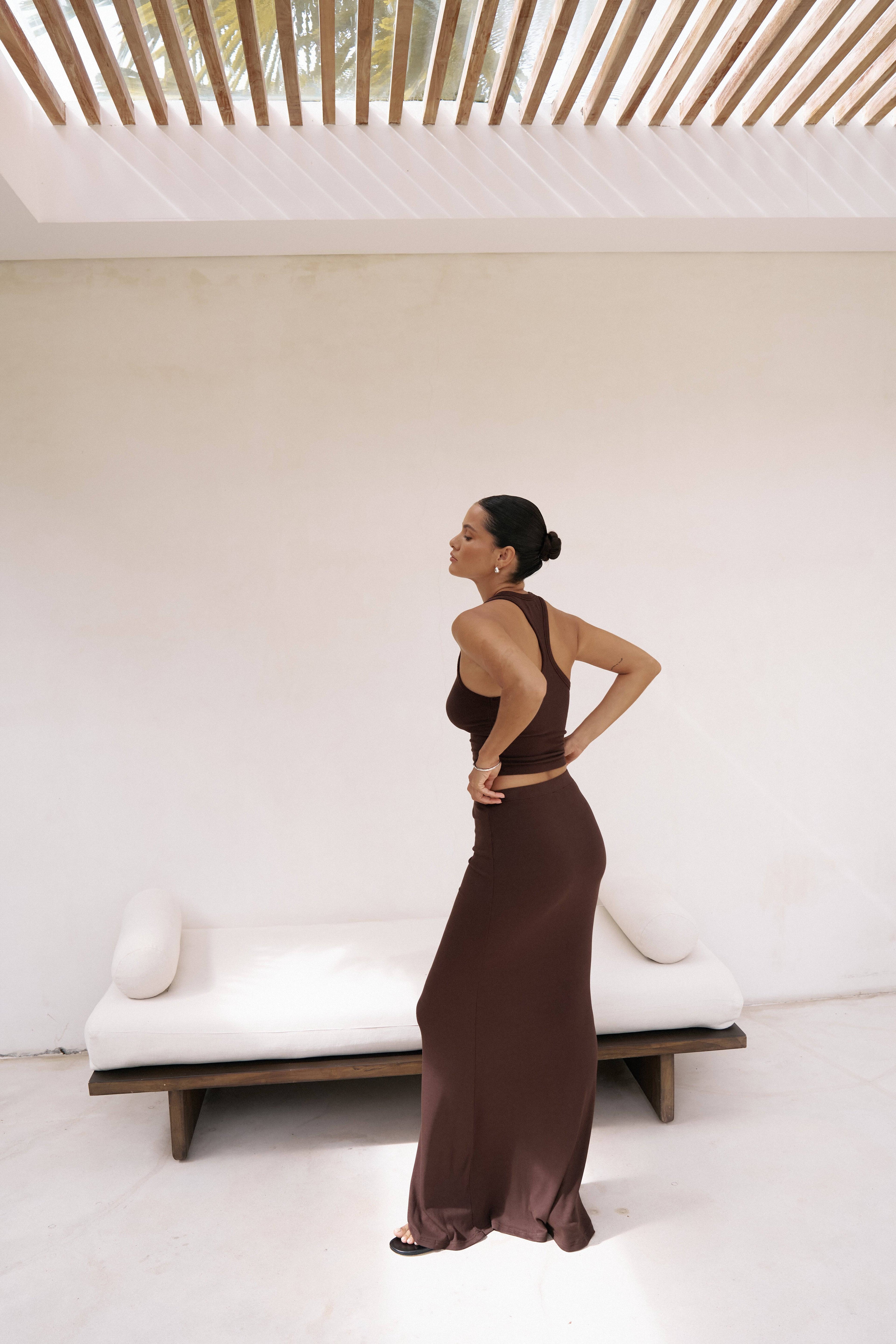 Riot Lounge Dom Maxi Skirt in chocolate, back view, flowing fabric, high waist, stylish design for casual or dressy occasions.