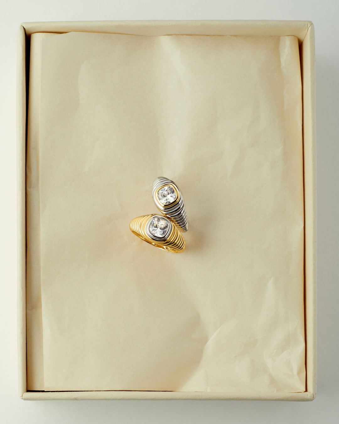 The Luv Aj Georgia Stone Signet Ring in Gold and Silver in a flat lay photo