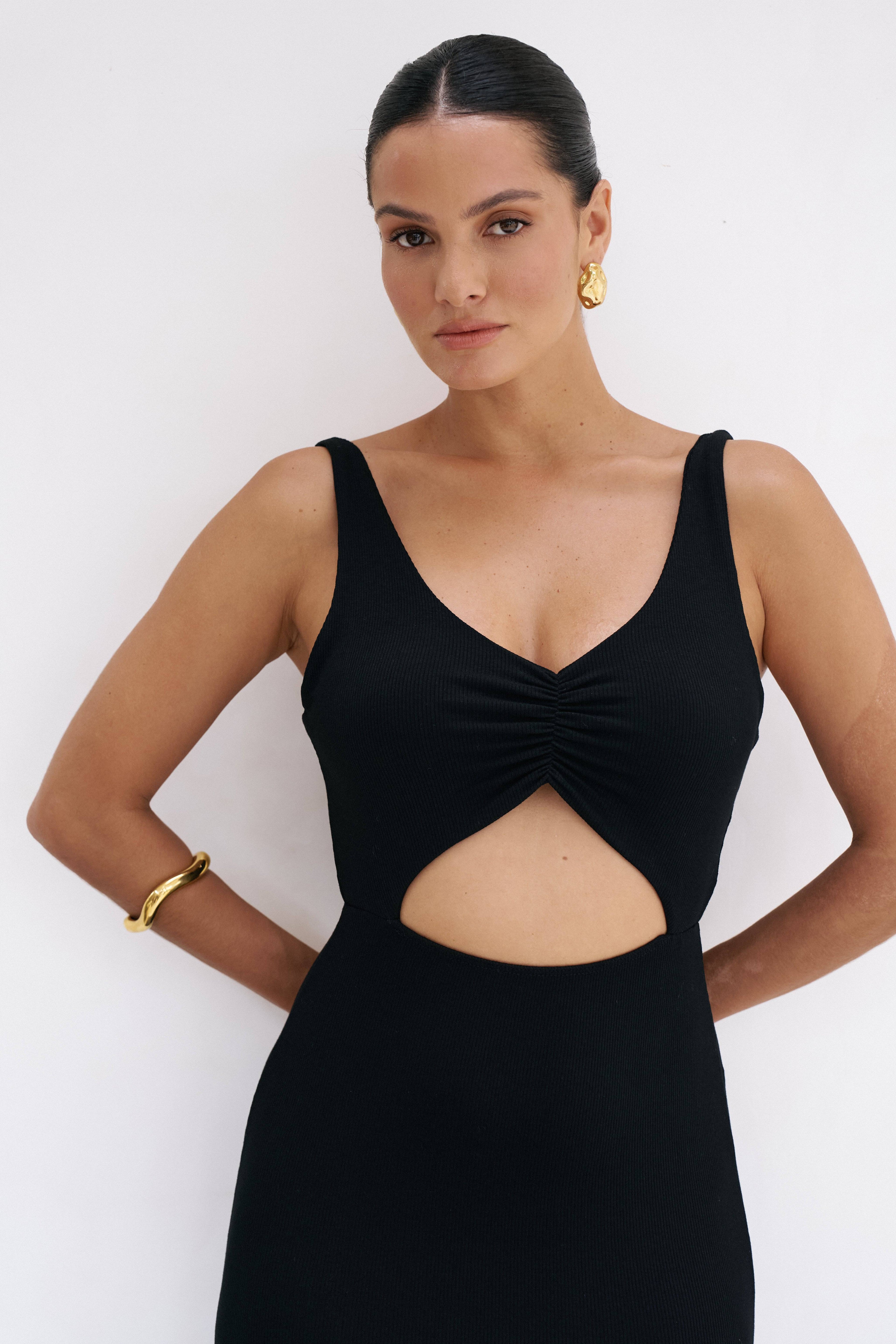 Black Reily Maxi Dress by Riot Lounge, flowy fabric with a fitted bodice and long skirt, perfect for elegant occasions.