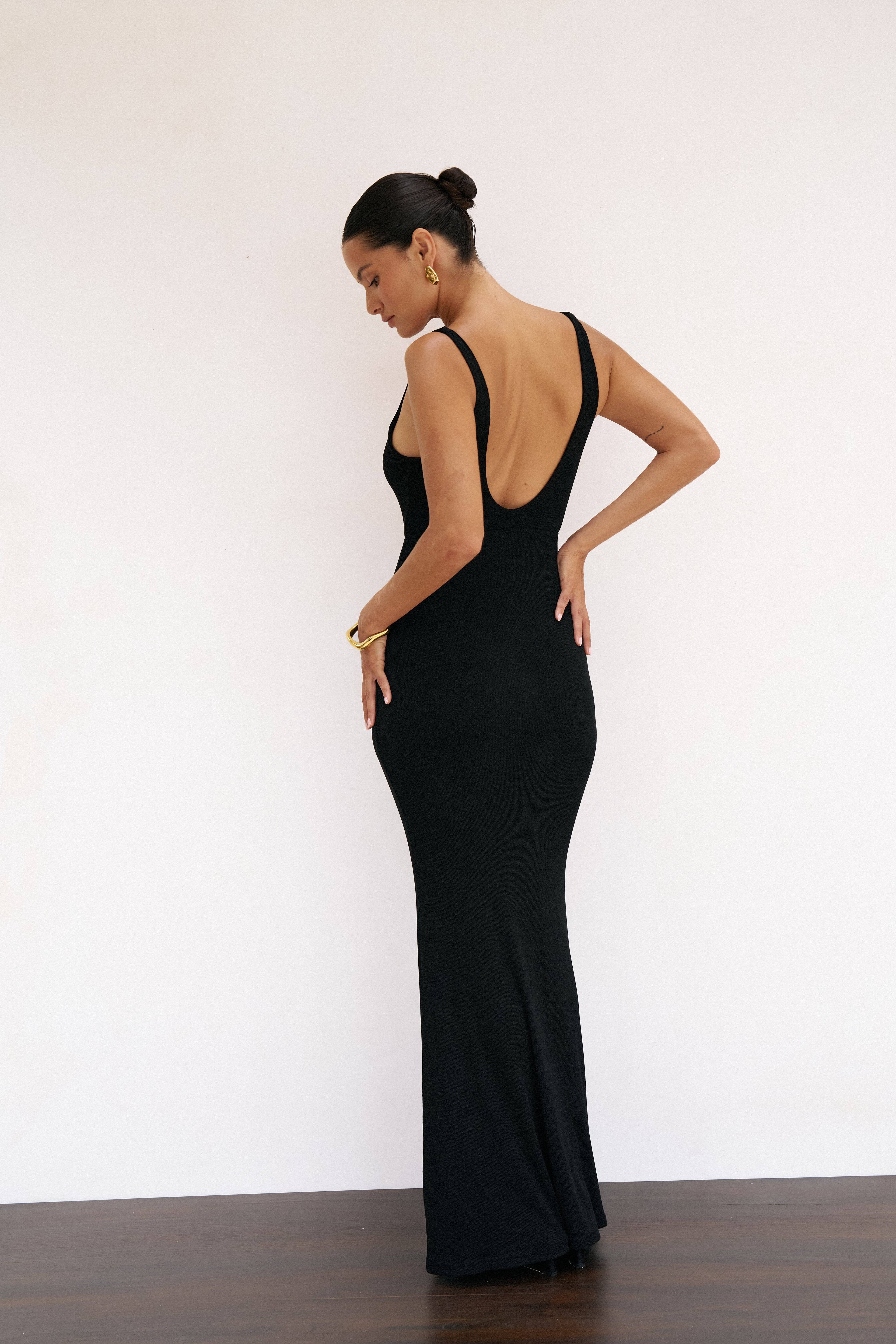 Black Reily Maxi Dress by Riot Lounge, flowing fabric with a stylish silhouette, perfect for elegant occasions.