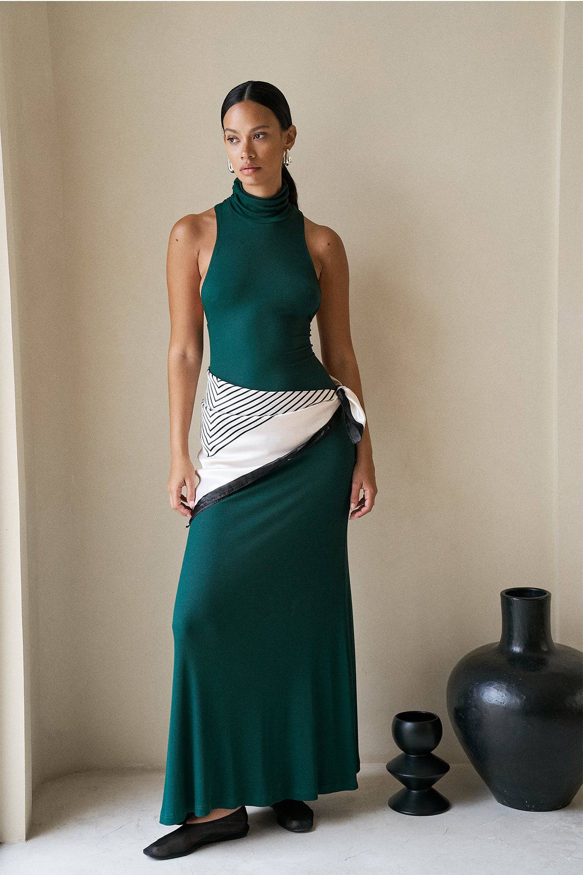 Forest green Maeve Maxi Dress by Riot Lounge with soft ribbed fabric, stylish and comfortable for casual or dressy occasions.