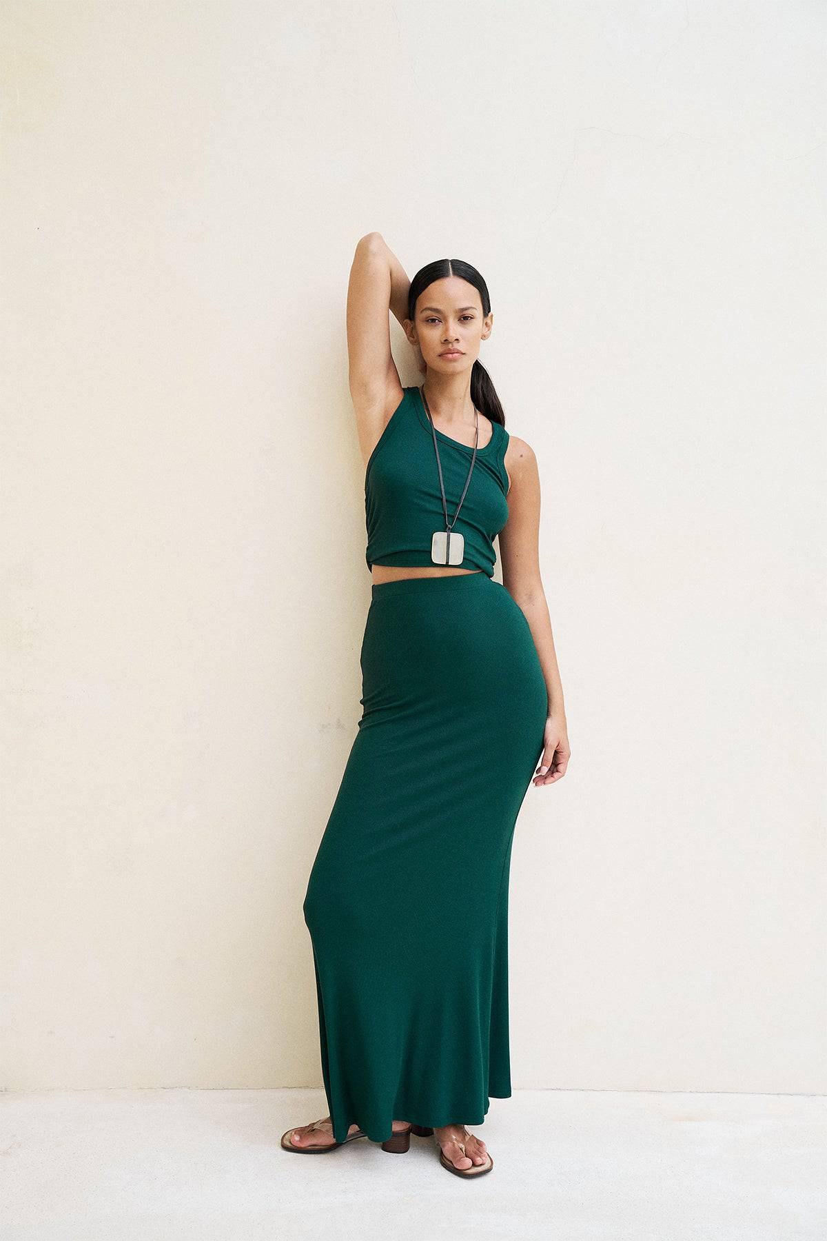 Forest green Riot Lounge Dom Racerback Tank top with soft ribbed fabric, casual sleeveless design, perfect for comfortable everyday wear.